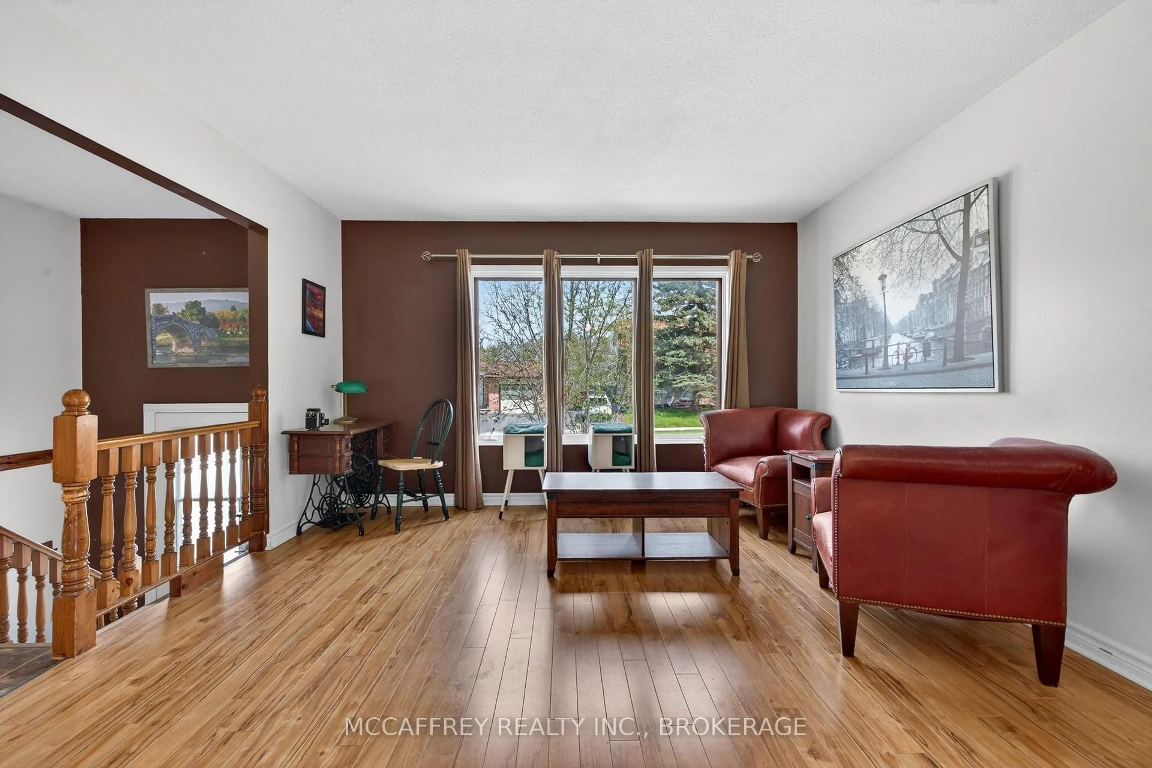 Living room with furniture, wood/laminate floor for 1075 Basswood Pl, Kingston Ontario K7P 1K4