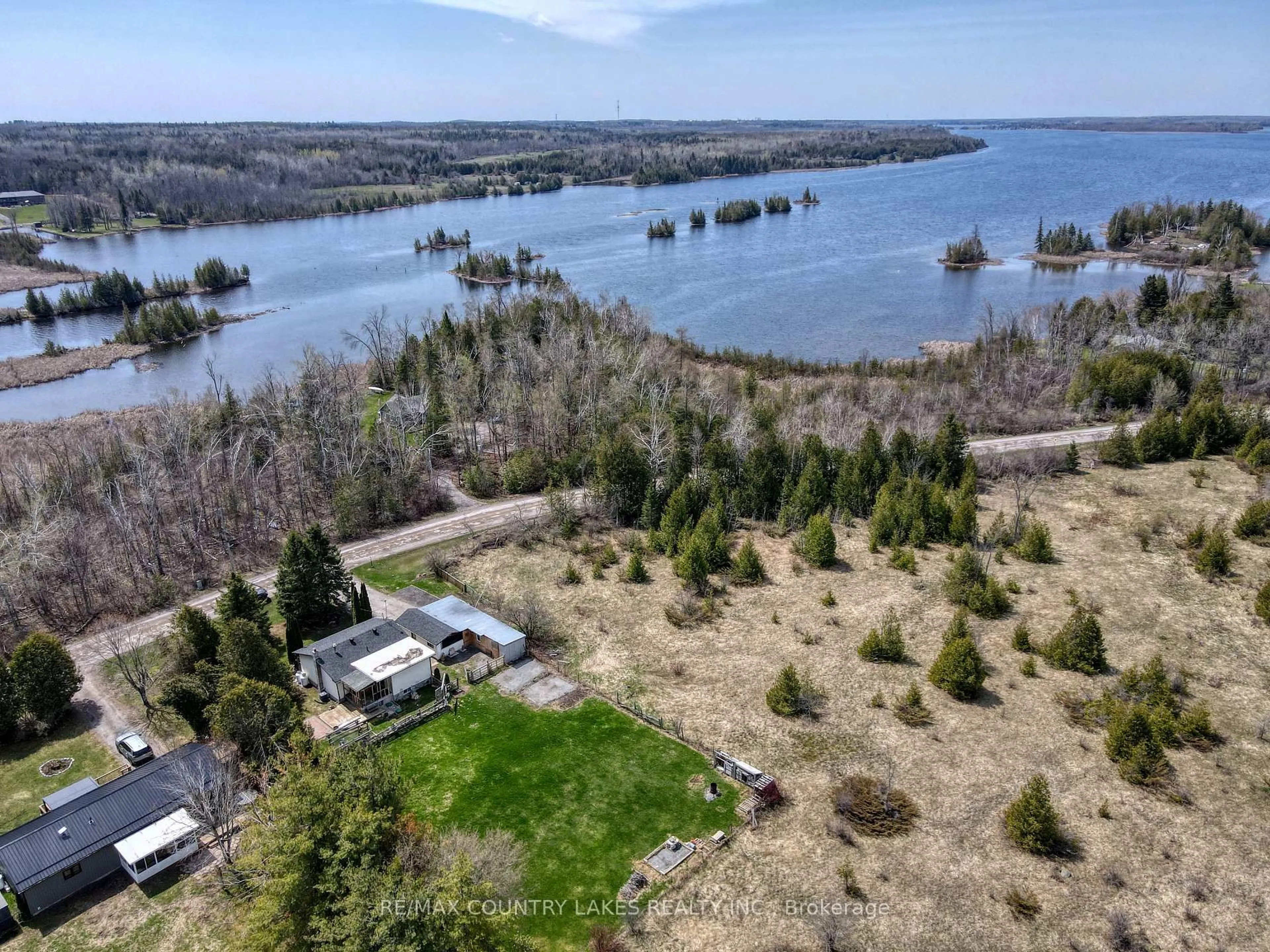 A pic from outside/outdoor area/front of a property/back of a property/a pic from drone, water/lake/river/ocean view for 126 Mcguire Beach Rd, Kawartha Lakes Ontario K0M 2B0