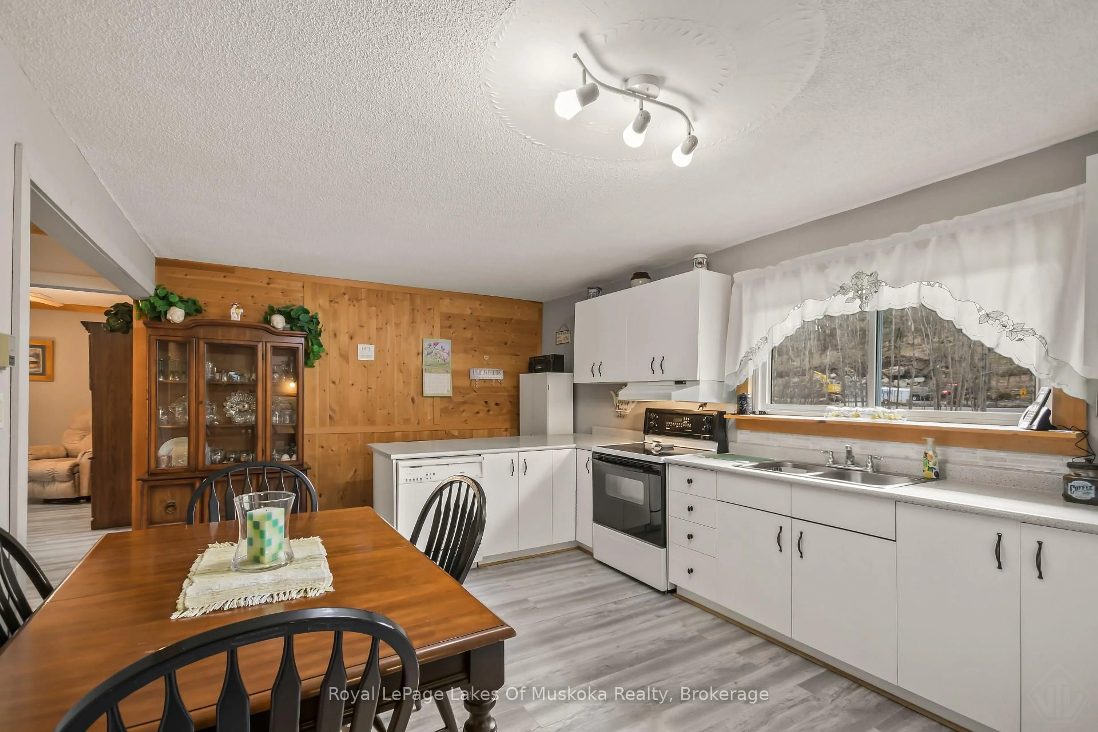 Open concept kitchen, wood/laminate floor for 1040 Windermere Rd, Muskoka Lakes Ontario P0B 1M0