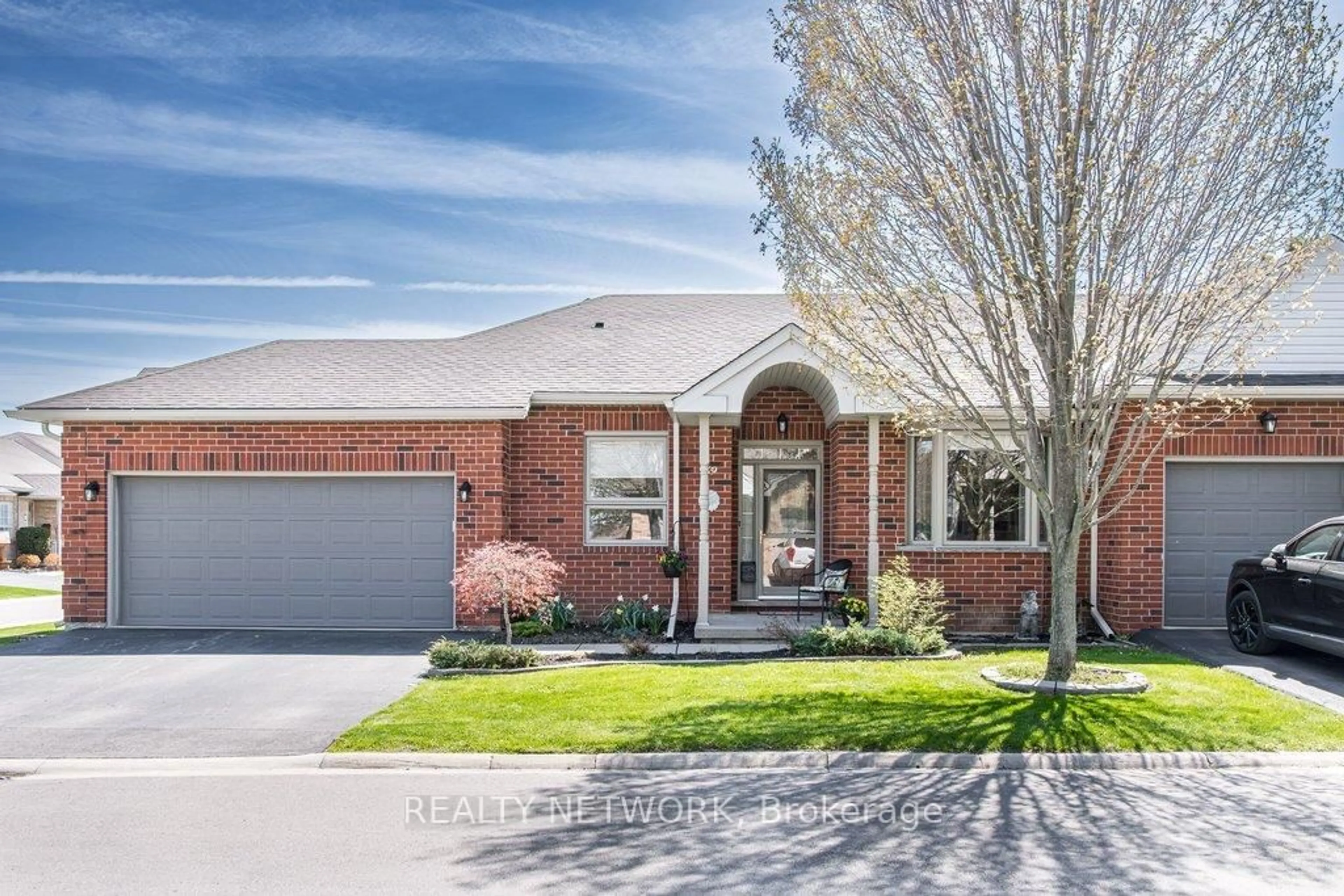 Home with brick exterior material, street for 59 Northern Breeze St #13, Hamilton Ontario L0R 1W0