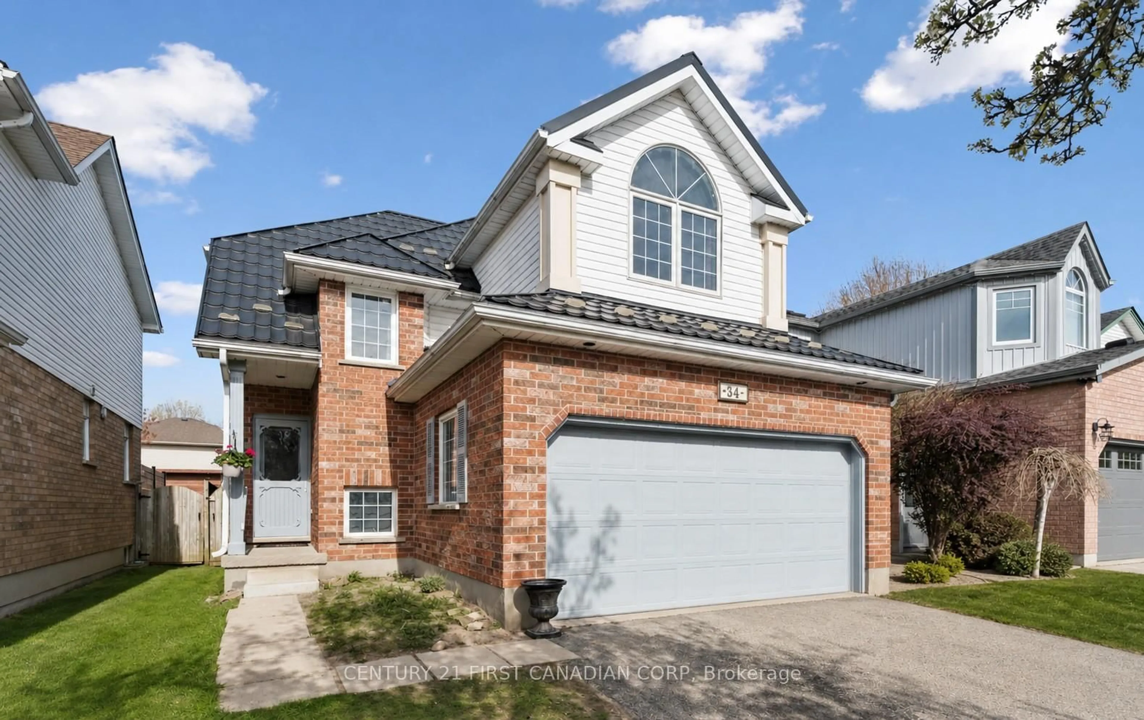 Home with brick exterior material, street for 34 Waxwing Cres, Guelph Ontario N1C 1E3