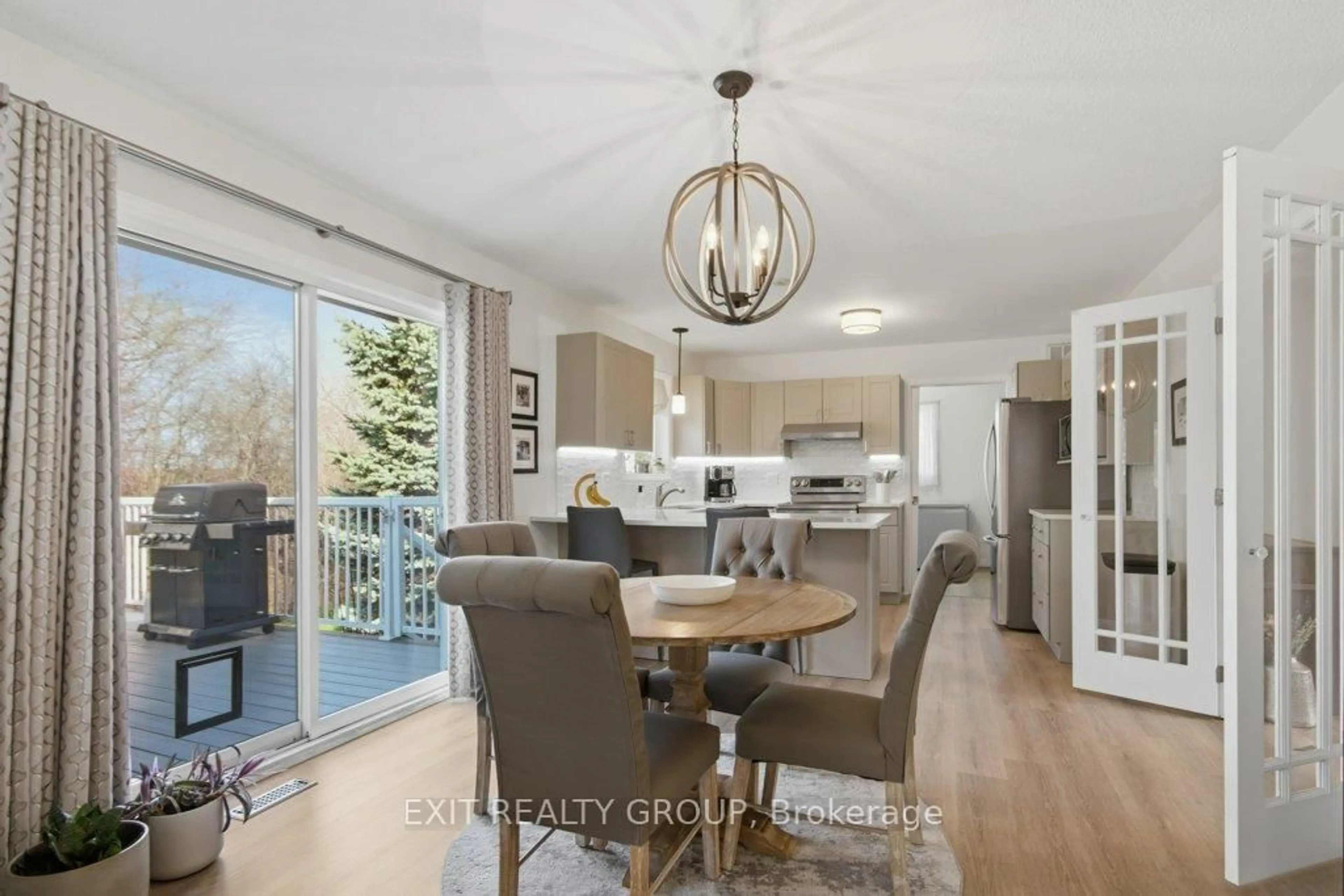Open concept kitchen, wood/laminate floor for 73 Sand Banks Crt, Prince Edward County Ontario K0K 3L0