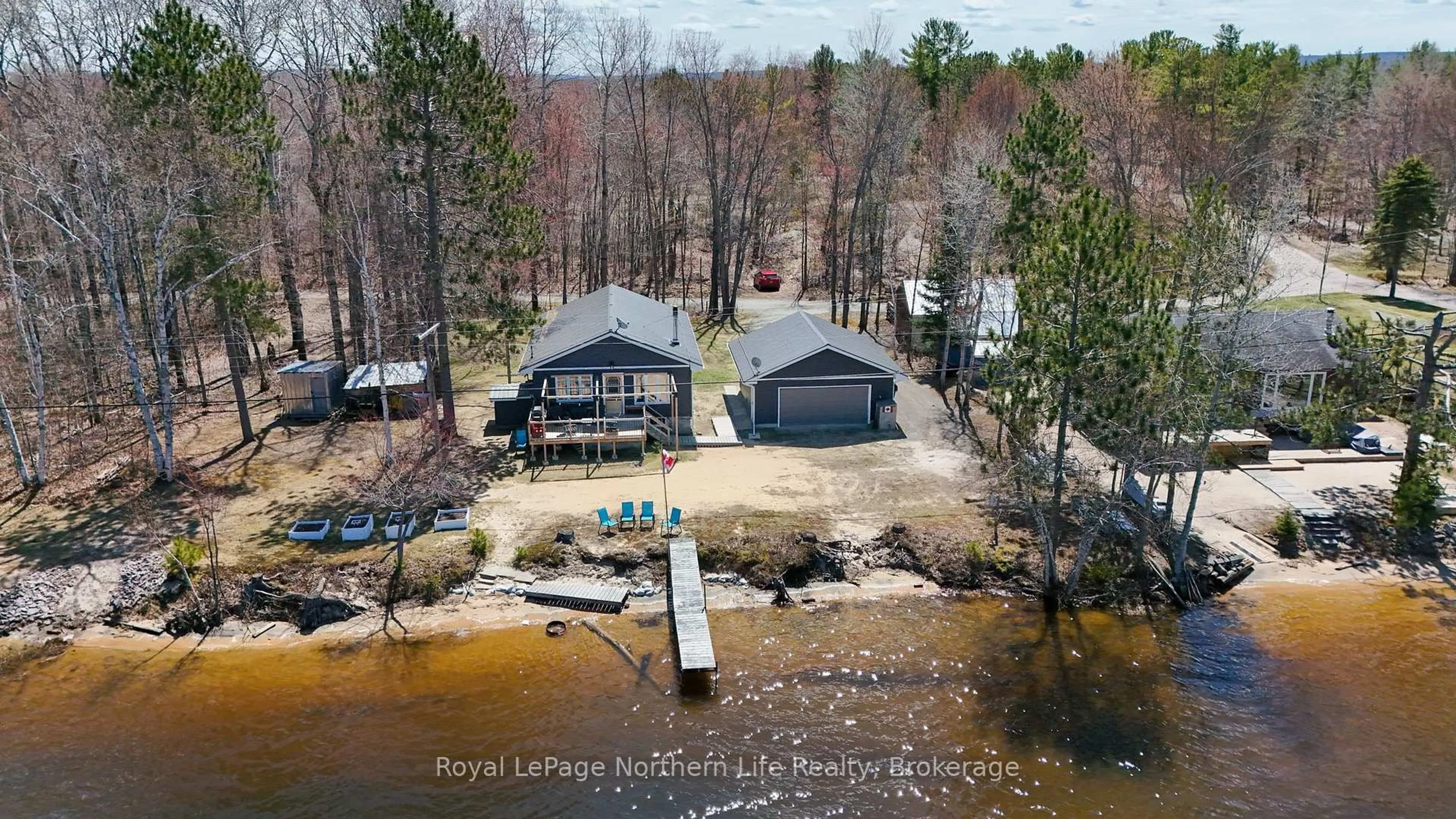 A pic from outside/outdoor area/front of a property/back of a property/a pic from drone, water/lake/river/ocean view for 405 Bear Creek Rd, Nipissing Ontario P0H 1H0