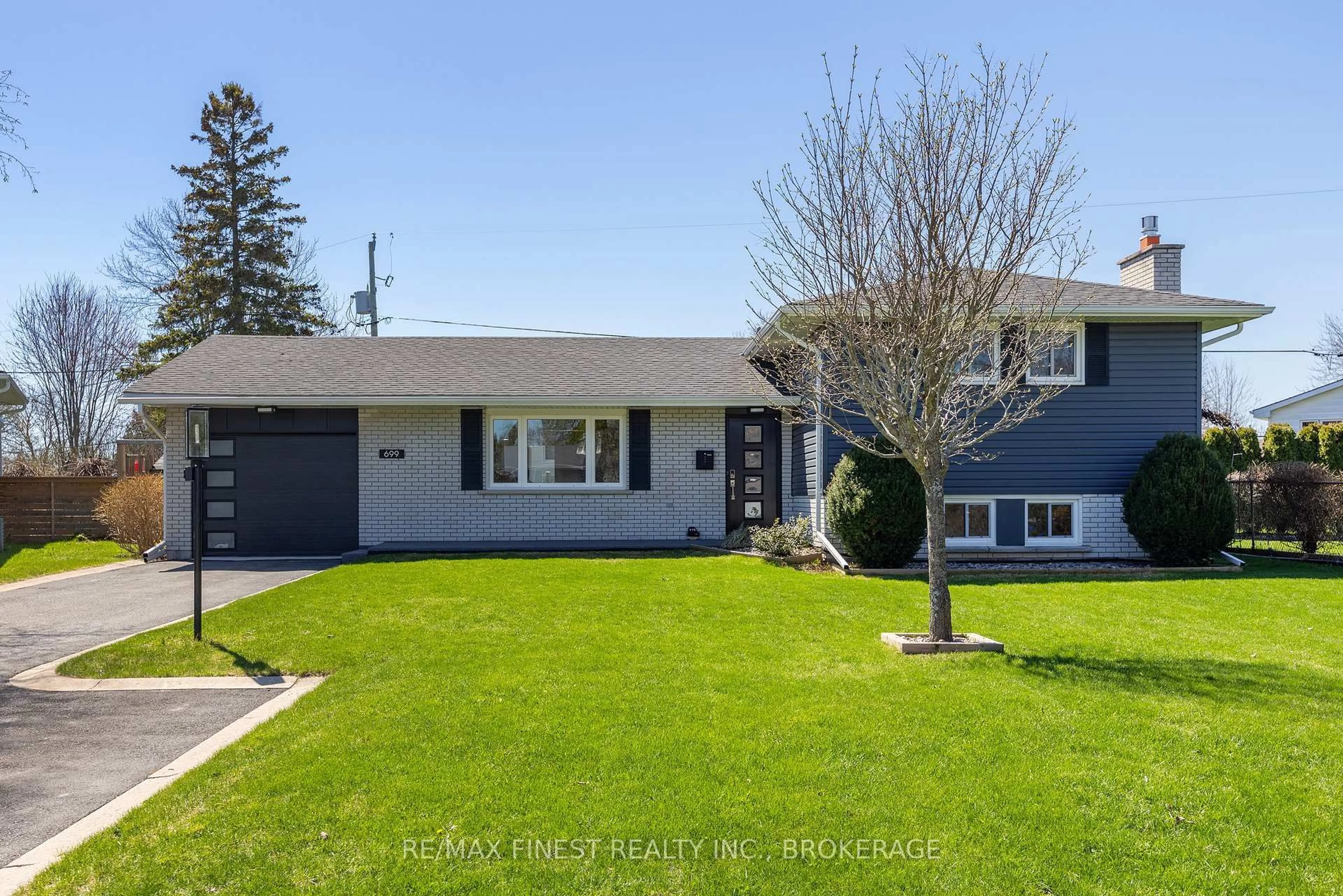 Home with vinyl exterior material, street for 699 Wembly Pl, Kingston Ontario K7M 5L7