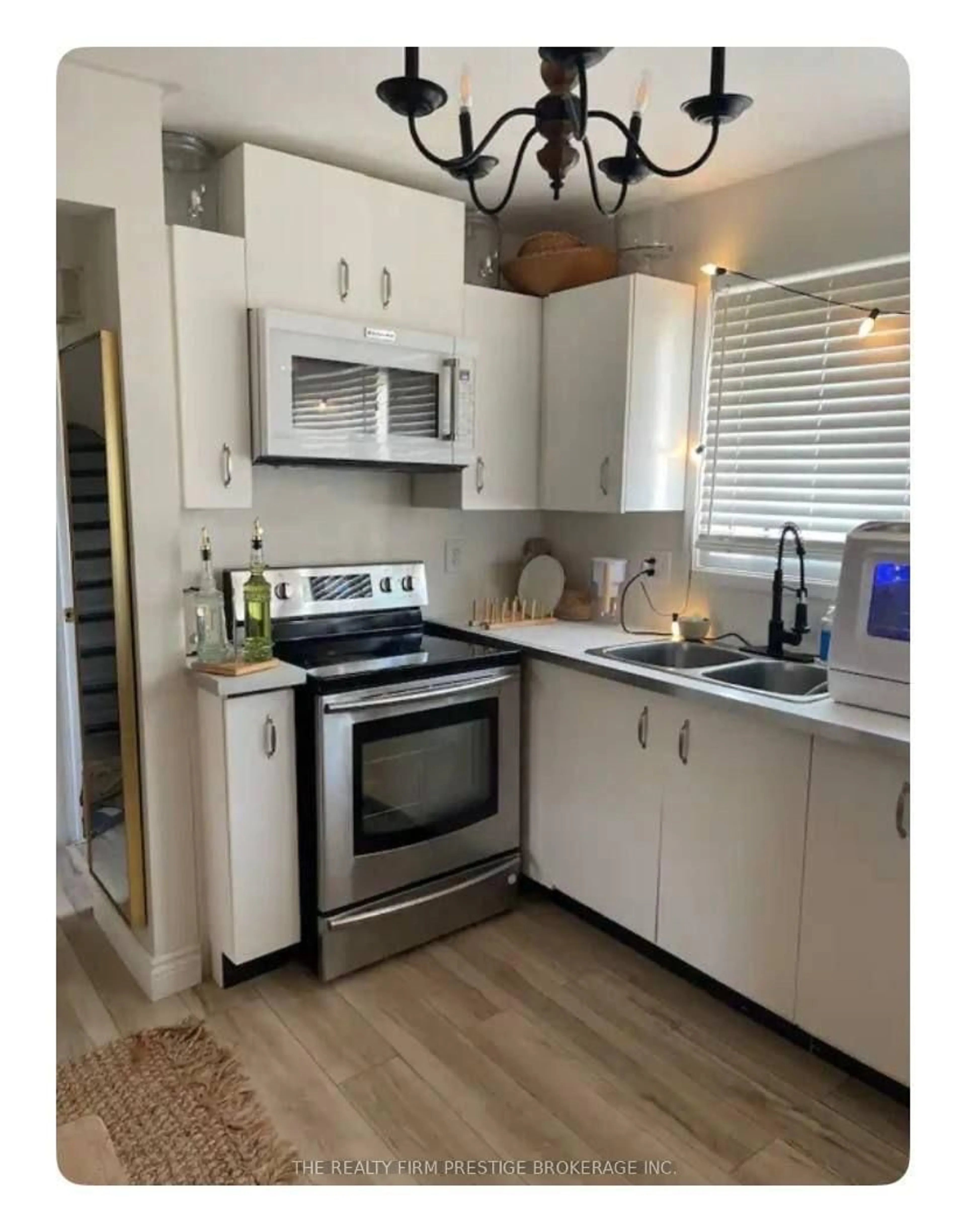 Open concept kitchen, wood/laminate floor for 1264 Limberlost Rd #18, London North Ontario N6G 3A5