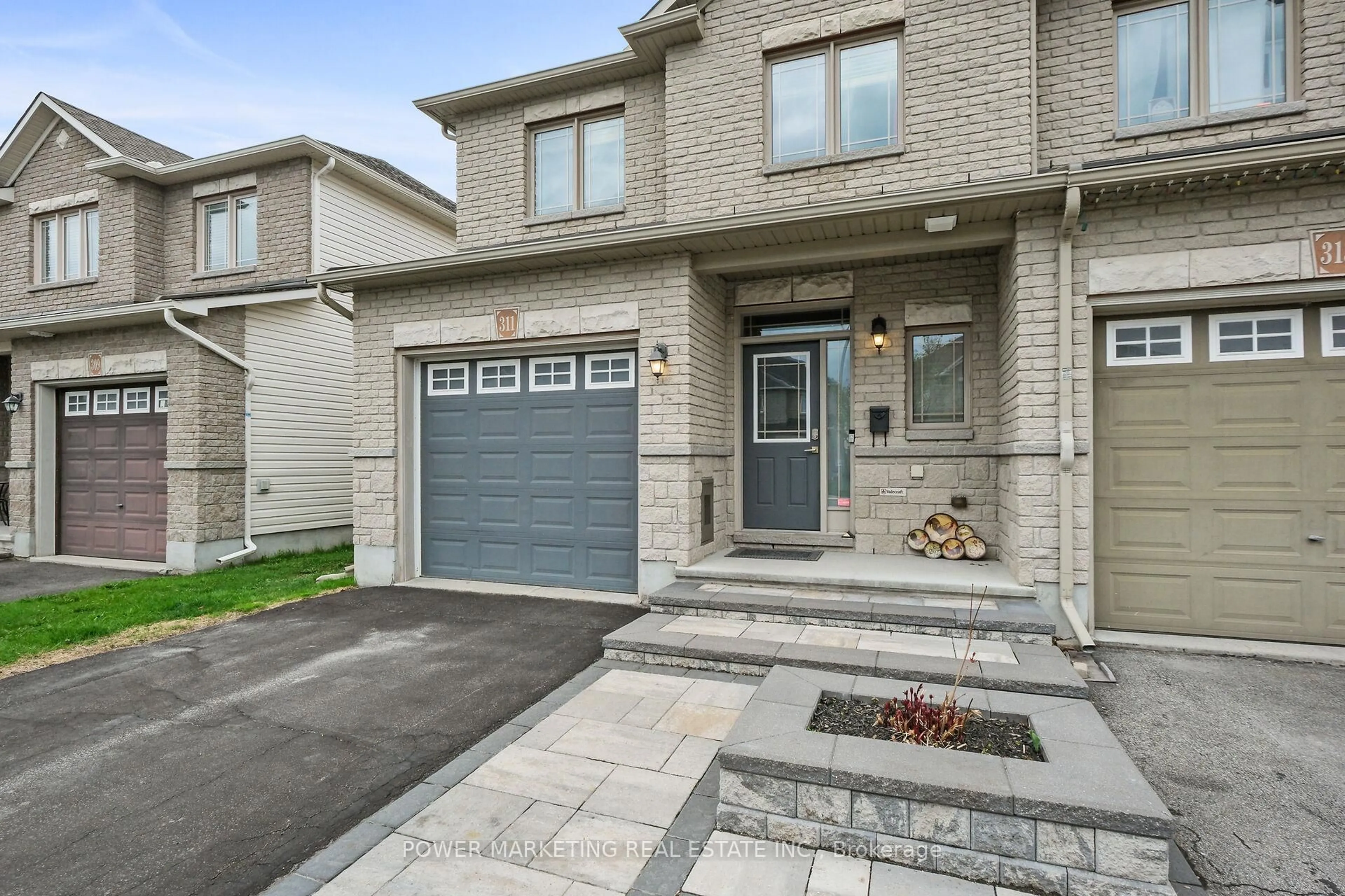 Home with brick exterior material, street for 311 Travis St, Ottawa Ontario K1W 0E5