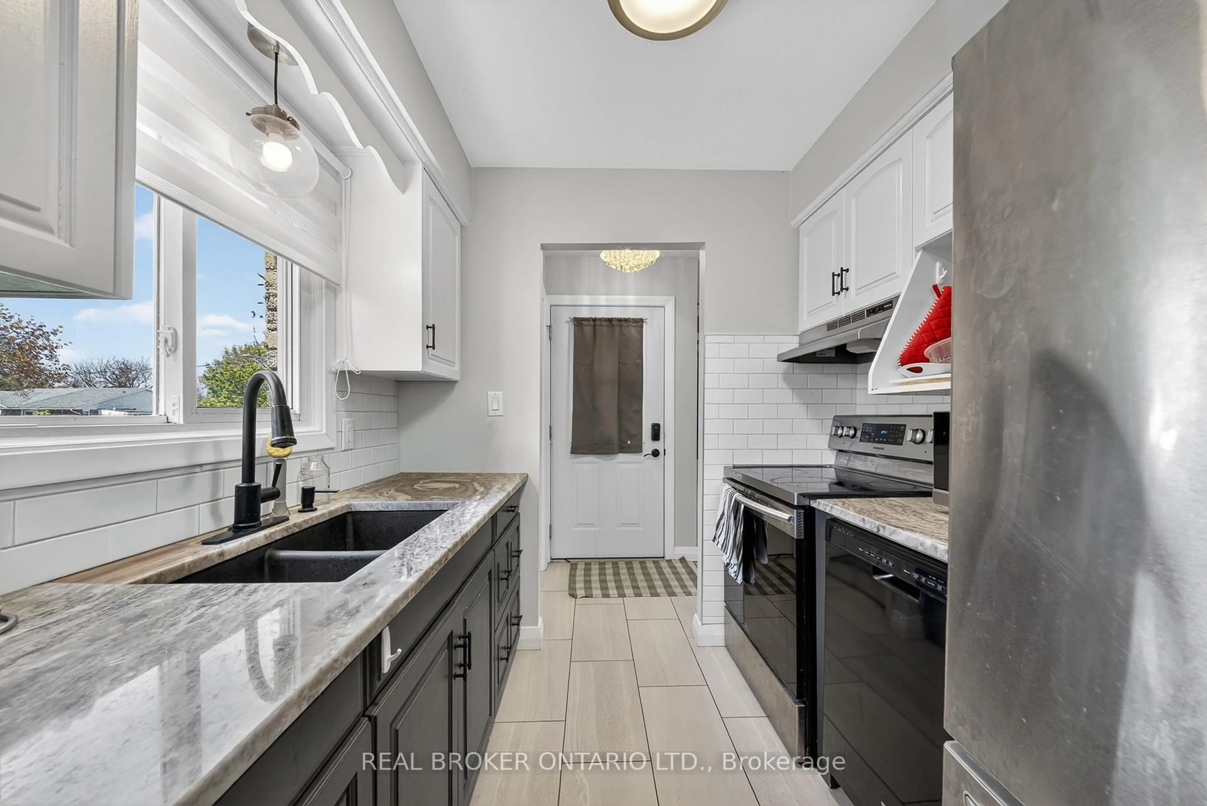 Kitchen with laundary machines, ceramic/tile floor for 136 Rockwood Ave, St. Catharines Ontario L2P 3R8