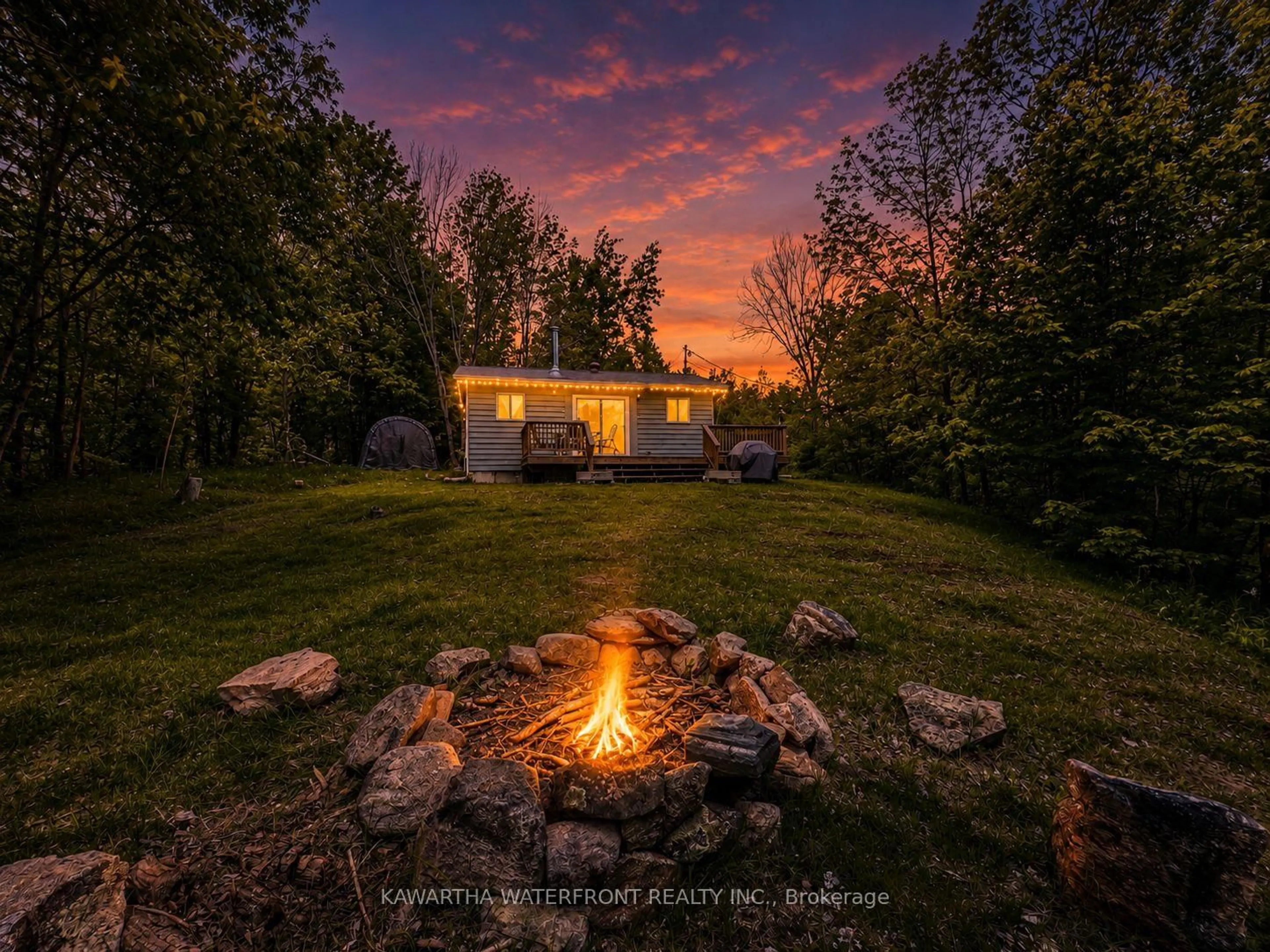 A pic from outside/outdoor area/front of a property/back of a property/a pic from drone, street for 1120 English Circ, Highlands East Ontario K0M 1R0
