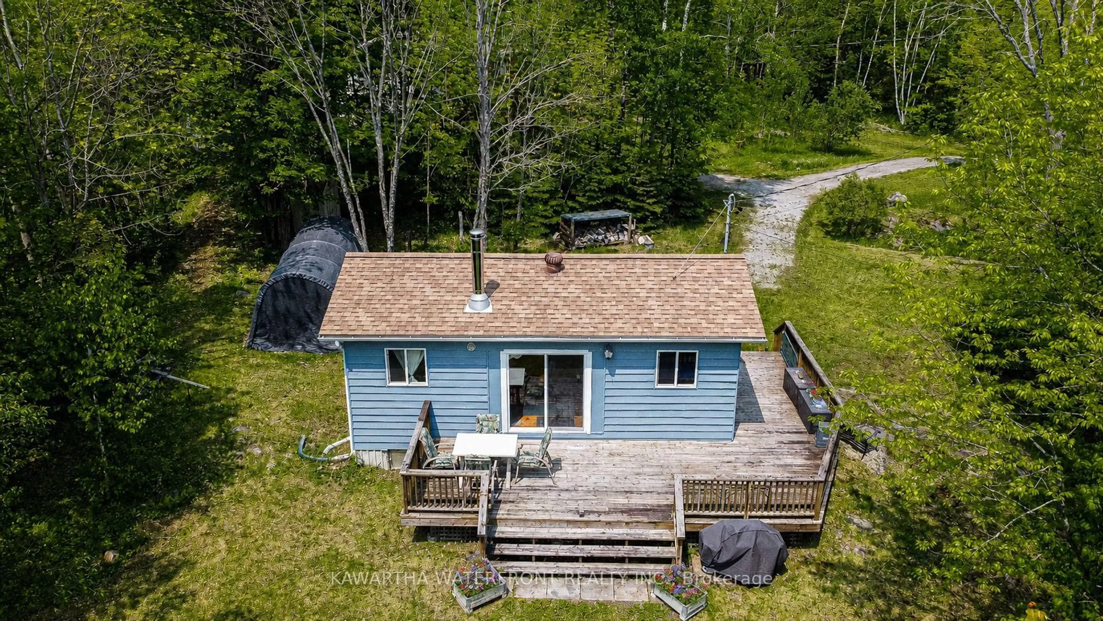 A pic from outside/outdoor area/front of a property/back of a property/a pic from drone, water/lake/river/ocean view for 1120 English Circ, Highlands East Ontario K0M 1R0