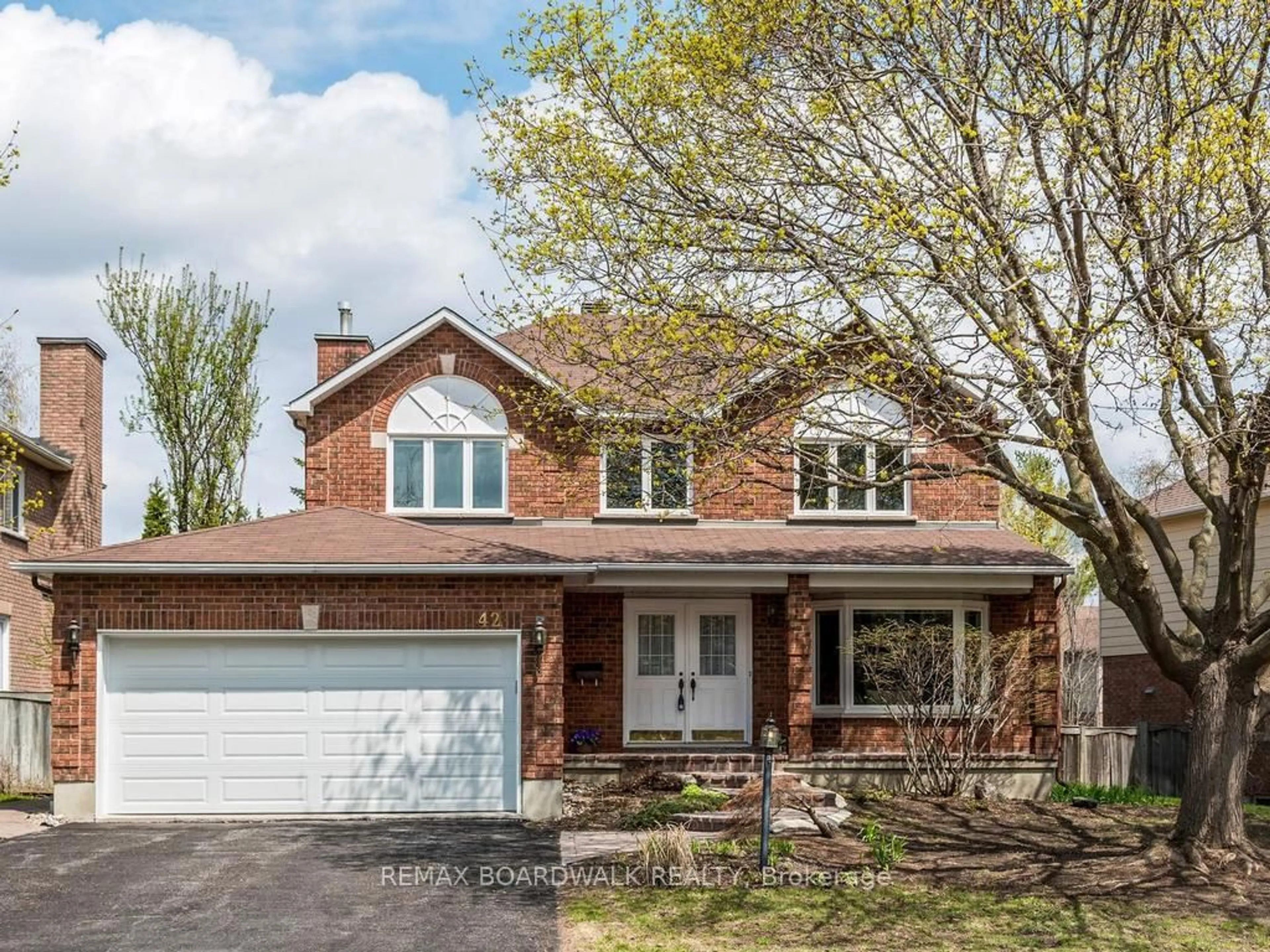 Home with brick exterior material, street for 42 Slade Cres, Ottawa Ontario K2K 2K9