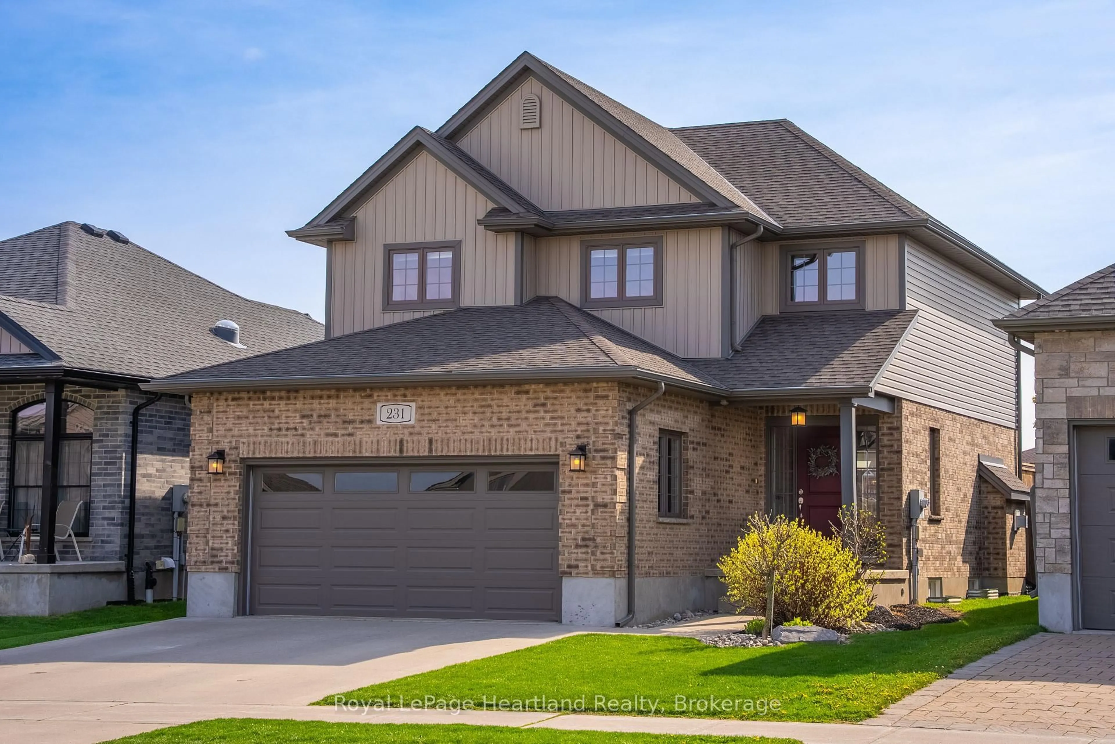 Home with brick exterior material, street for 231 Campanale Way, Lucan Biddulph Ontario N0M 2J0