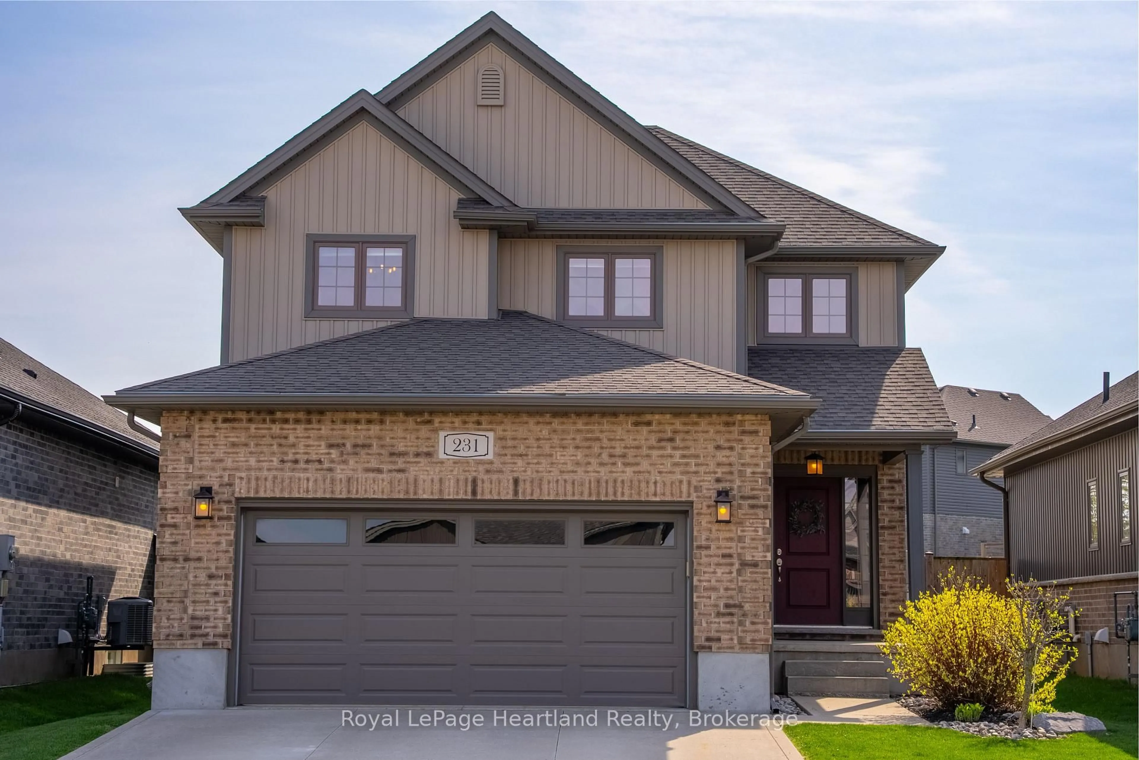 Home with brick exterior material, street for 231 Campanale Way, Lucan Biddulph Ontario N0M 2J0