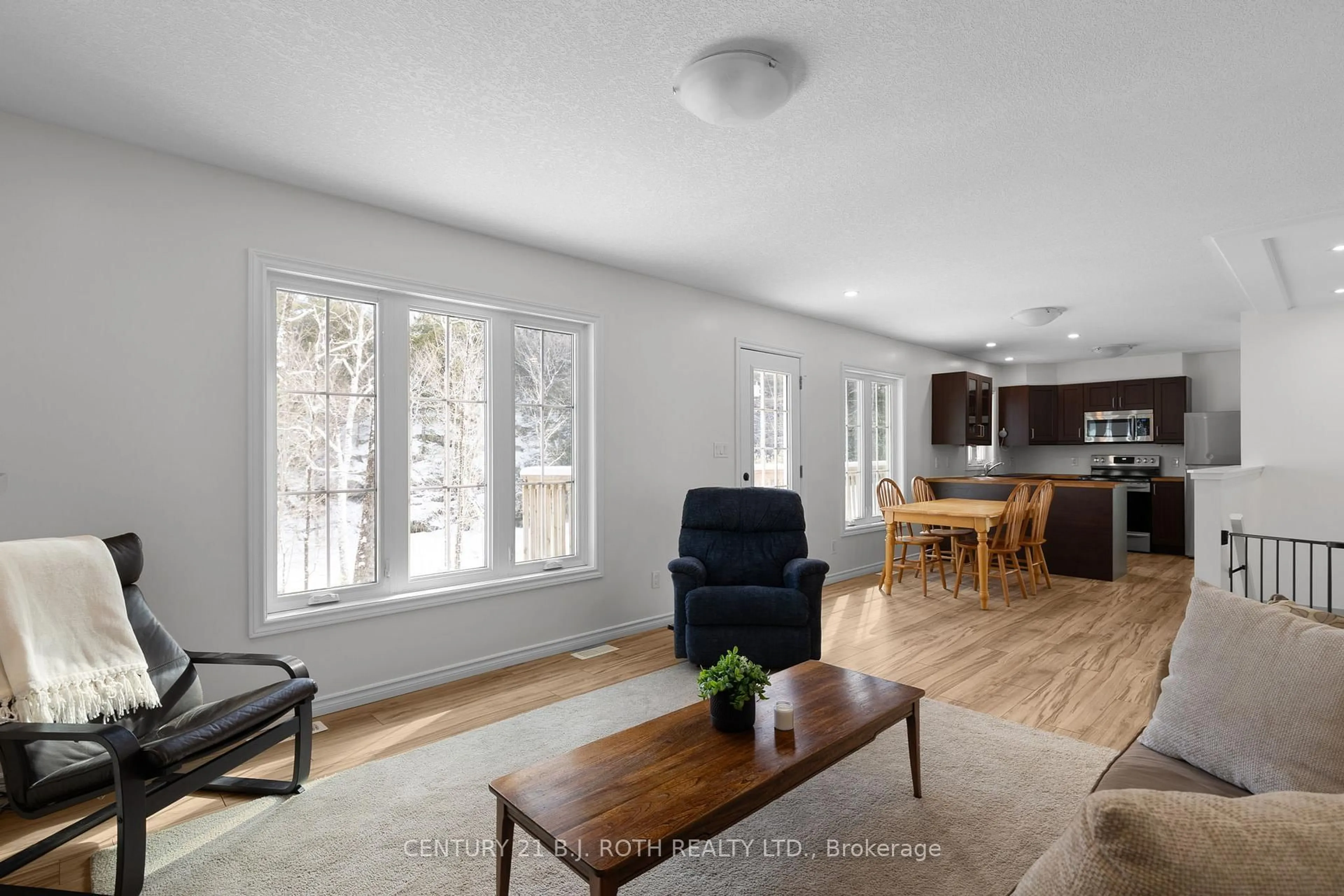 Living room with furniture, wood/laminate floor for 1040 Arthur Schulz Rd, Gravenhurst Ontario P0E 1G0
