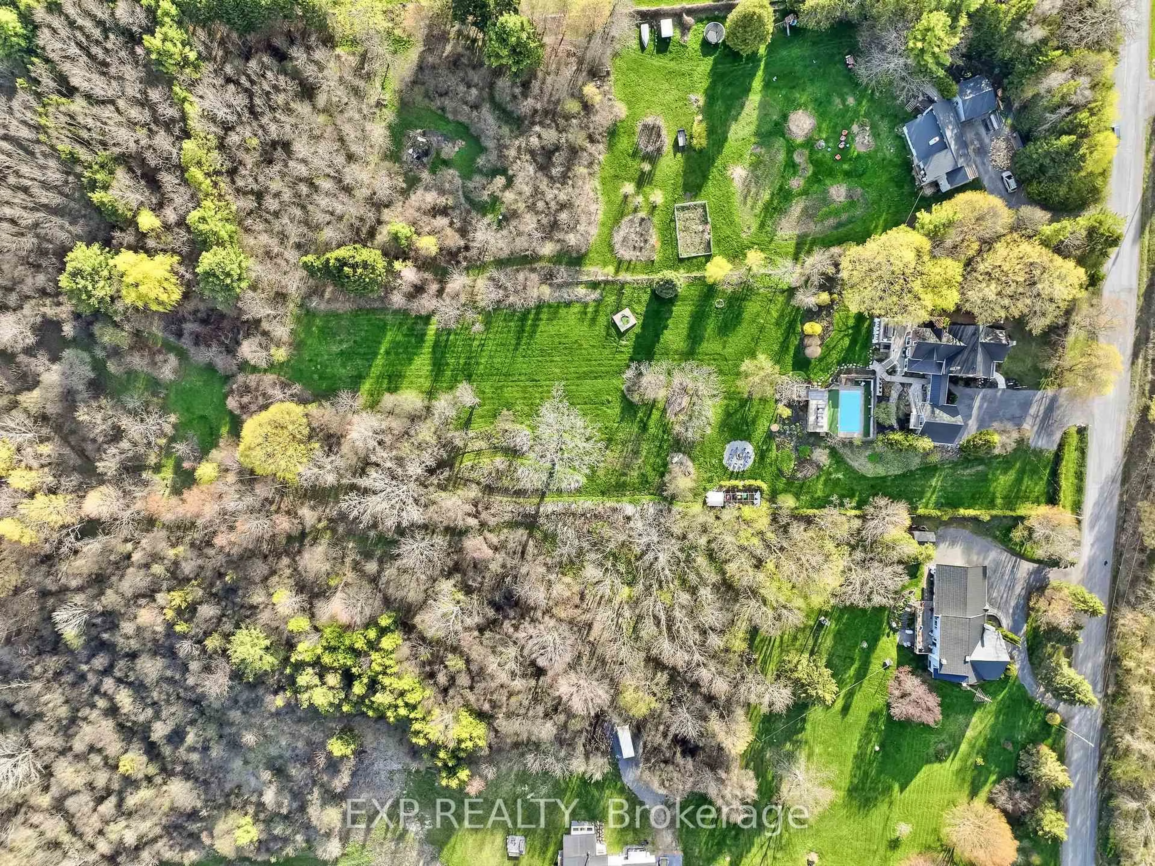 A pic from outside/outdoor area/front of a property/back of a property/a pic from drone, forest/trees view for 7823 Bickle Hill Rd, Hamilton Township Ontario K9A 4J7