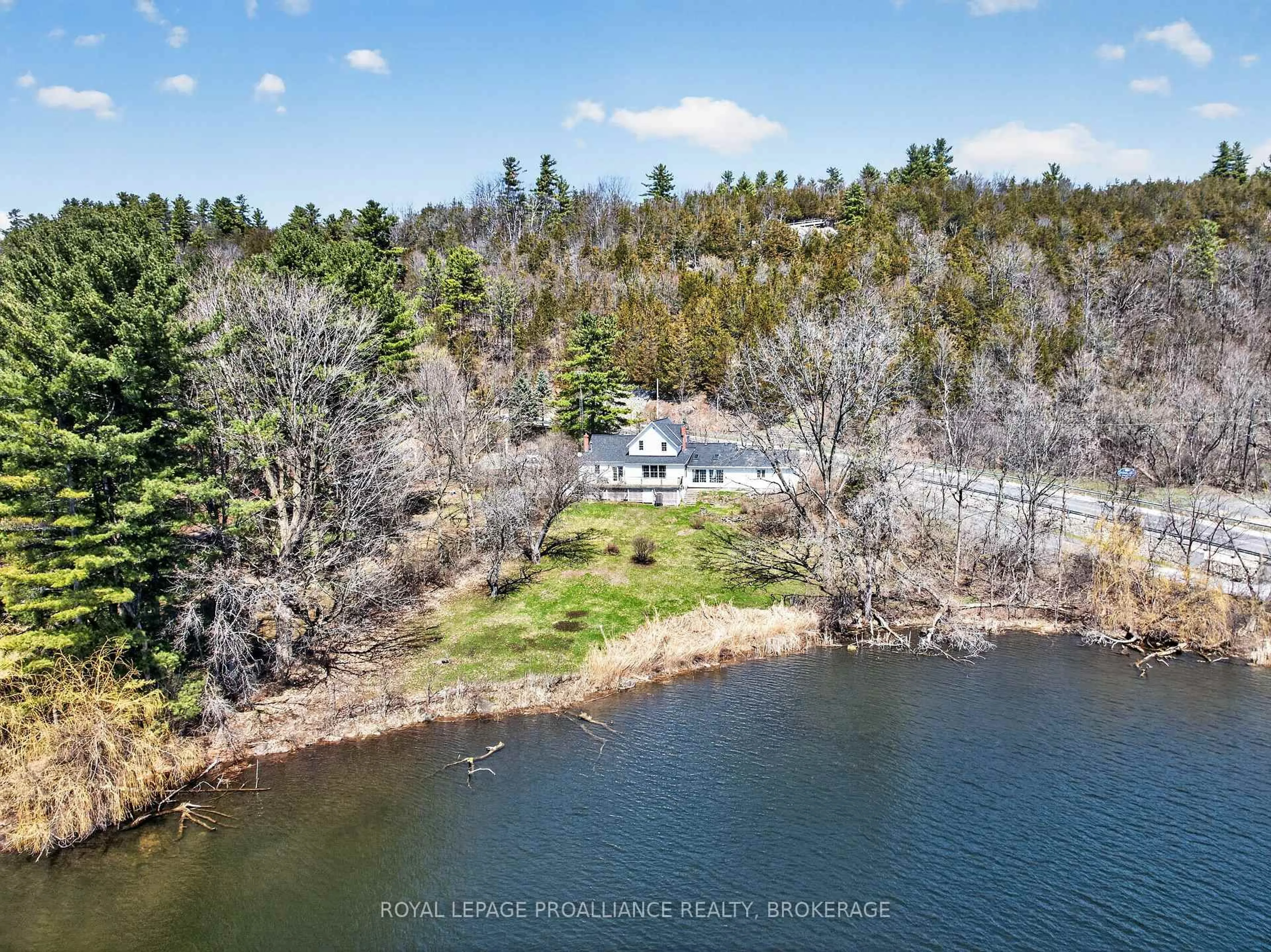 A pic from outside/outdoor area/front of a property/back of a property/a pic from drone, water/lake/river/ocean view for 1 Pond St, Westport Ontario K0G 1X0