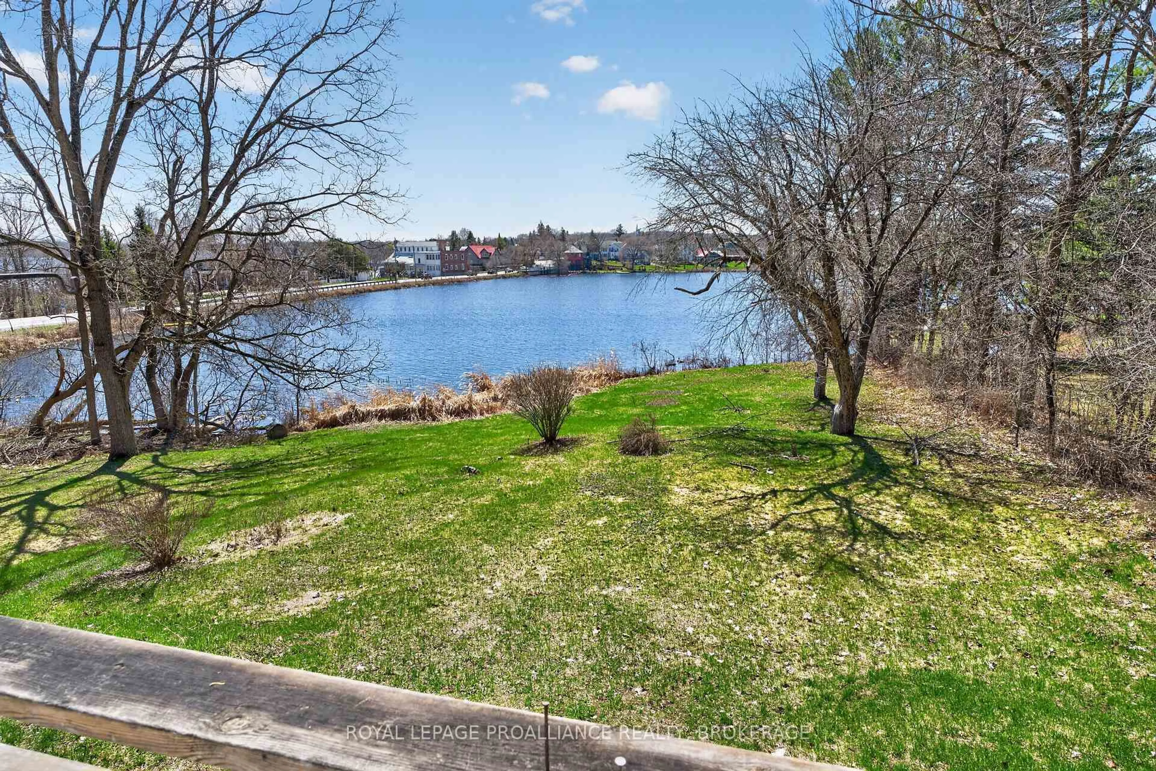 A pic from outside/outdoor area/front of a property/back of a property/a pic from drone, water/lake/river/ocean view for 1 Pond St, Westport Ontario K0G 1X0