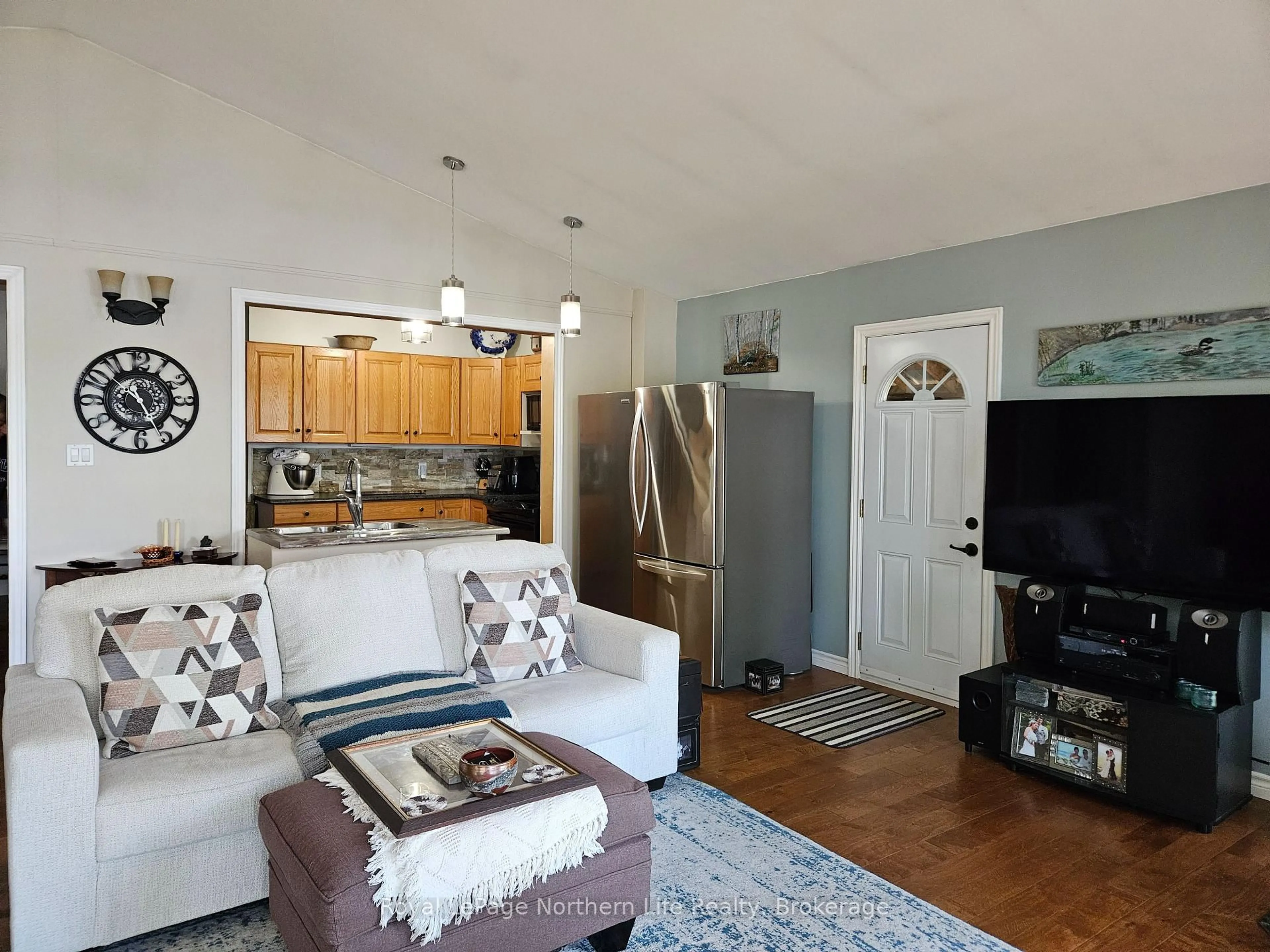 Living room with furniture, wood/laminate floor for 170 TALON LAKE Rd, Calvin Ontario P0H 2E0