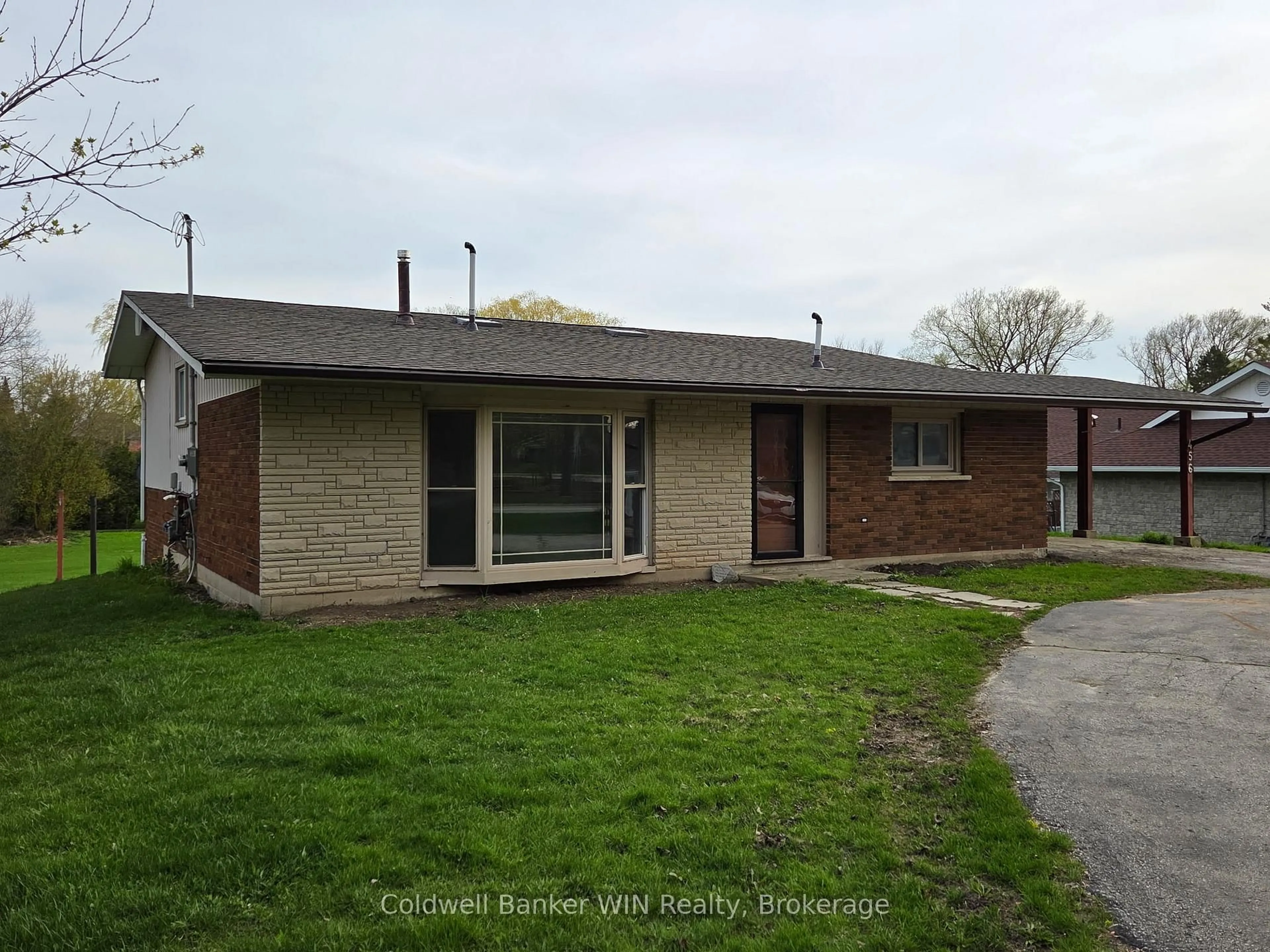 A pic from outside/outdoor area/front of a property/back of a property/a pic from drone, street for 456 Queen St, Wellington North Ontario N0G 2L3