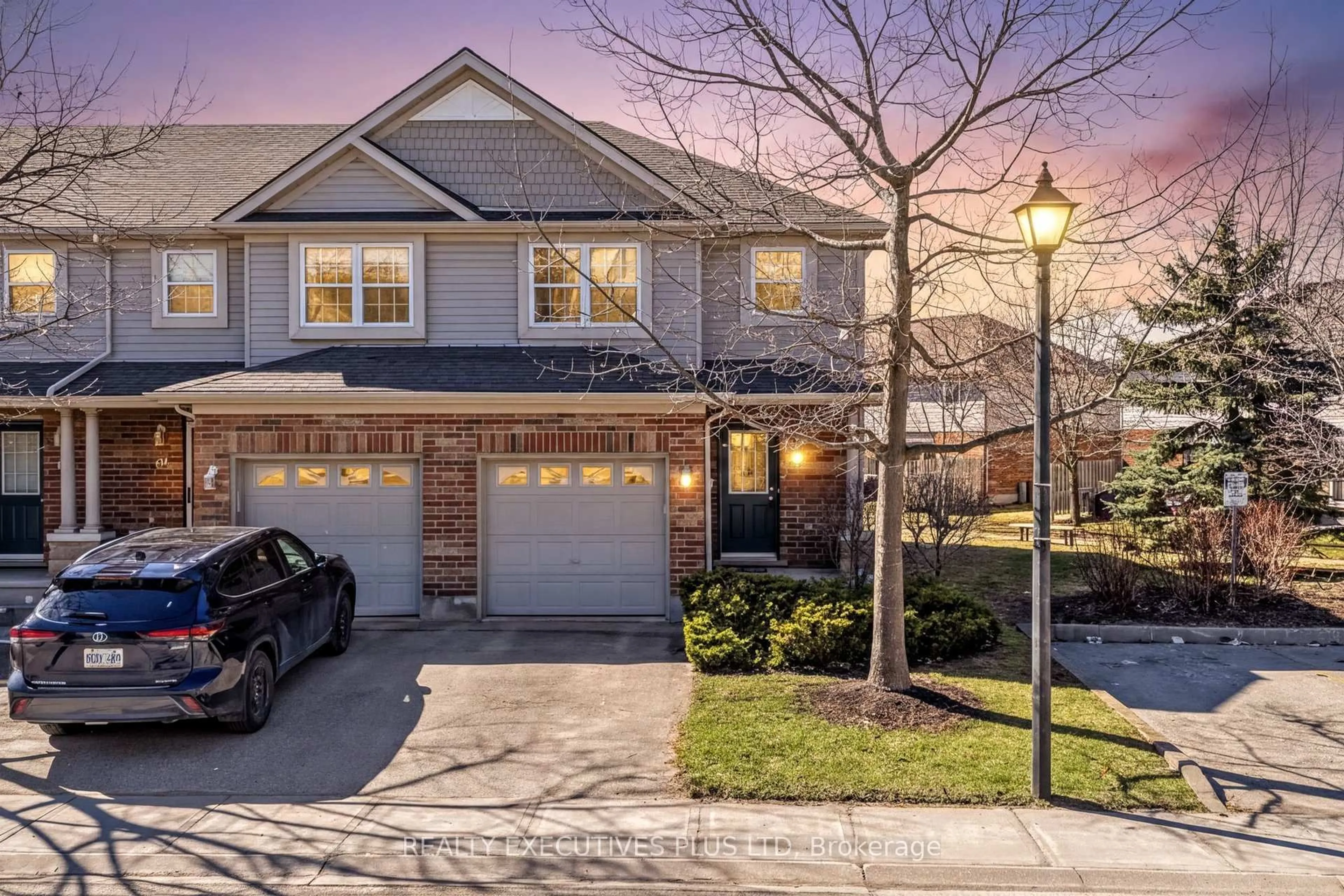 Home with brick exterior material, street for 30 Imperial Rd #70, Guelph Ontario N1K 1Y2