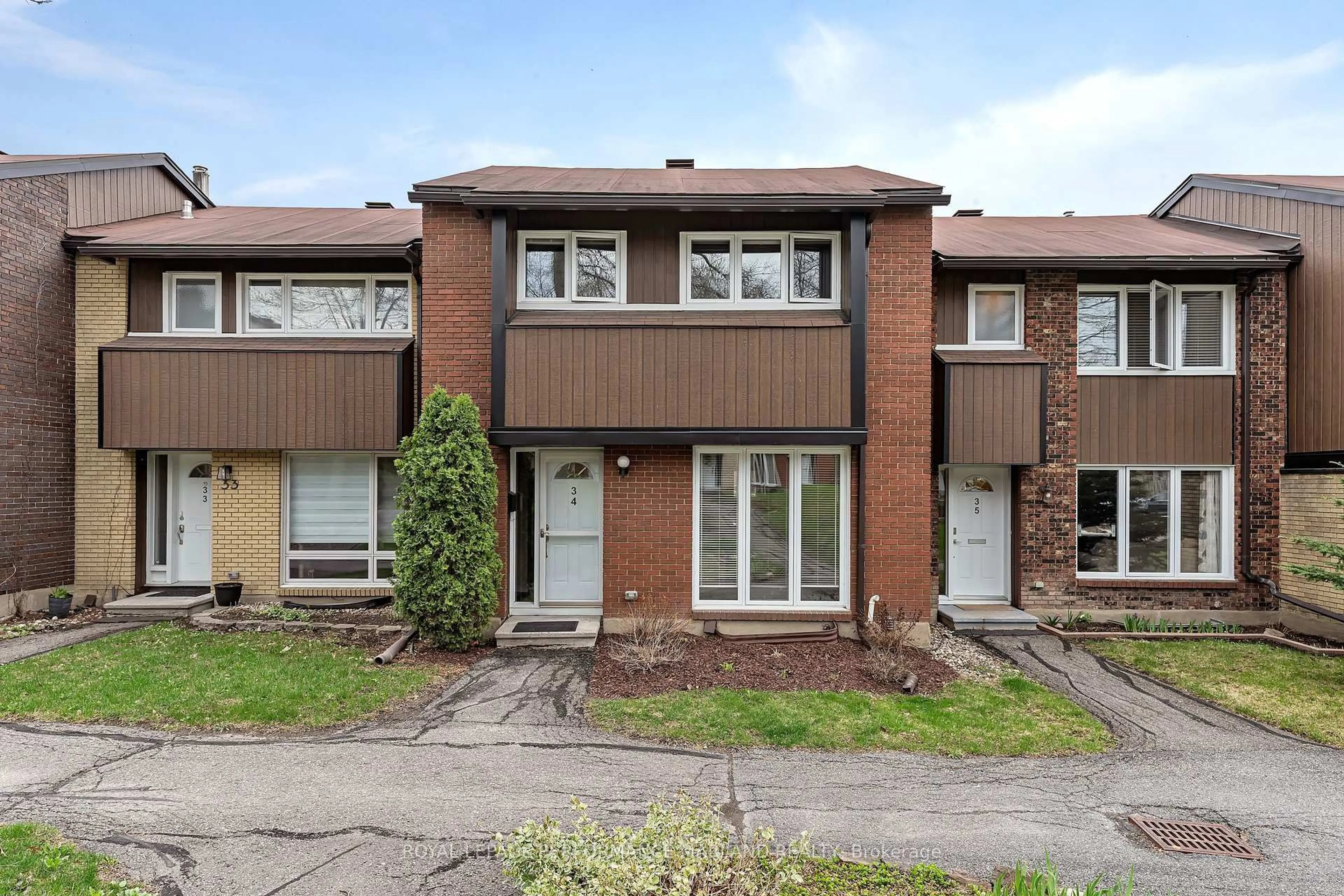 Home with brick exterior material, street for 1900 Marquis Ave #34, Ottawa Ontario K1J 8J2