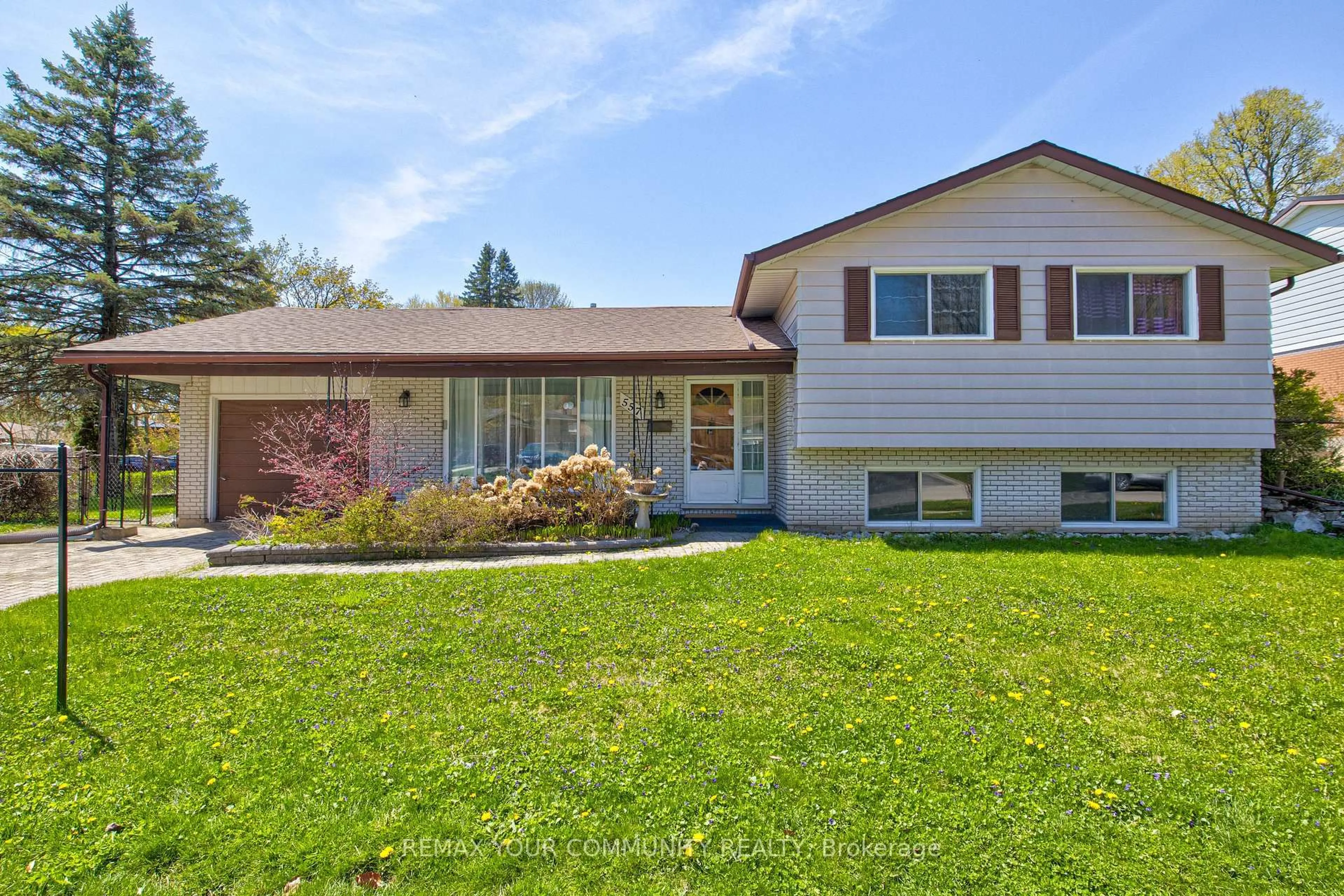 Home with vinyl exterior material, street for 557 Glen Manor Blvd, Waterloo Ontario N2L 4T7