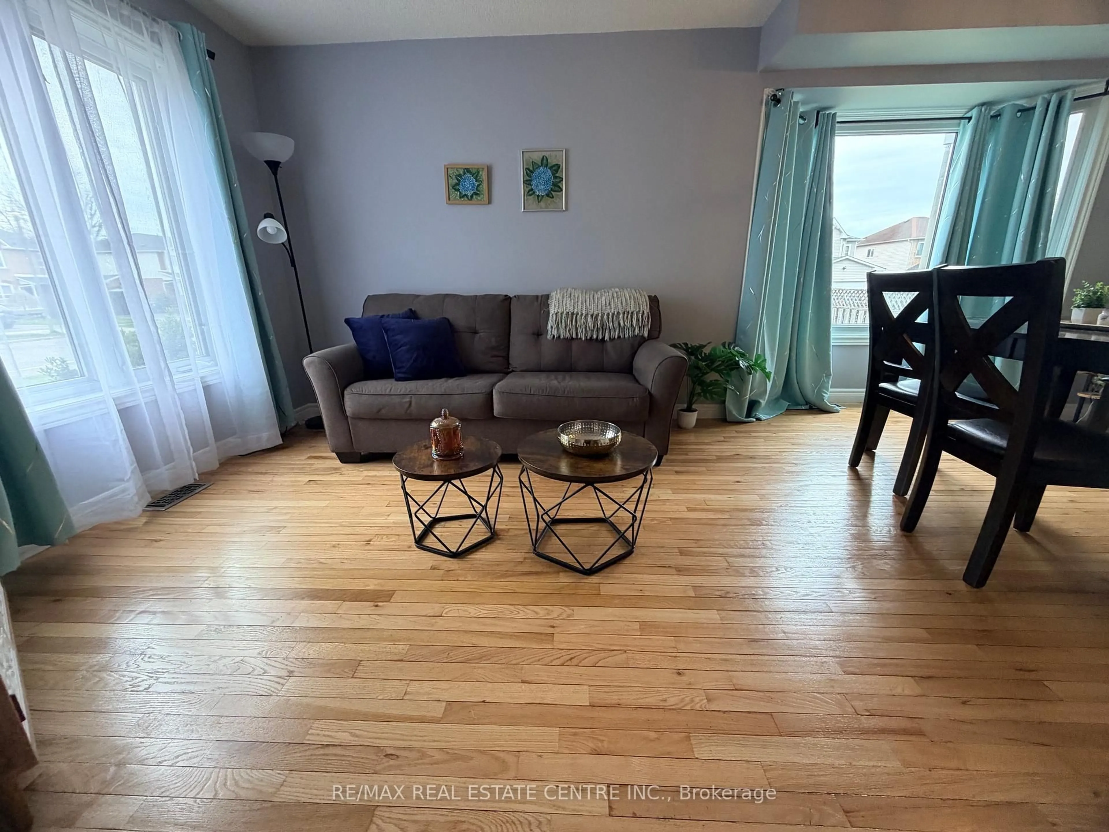 Living room with furniture, wood/laminate floor for 264 Langlaw Dr, Cambridge Ontario N1P 1B7