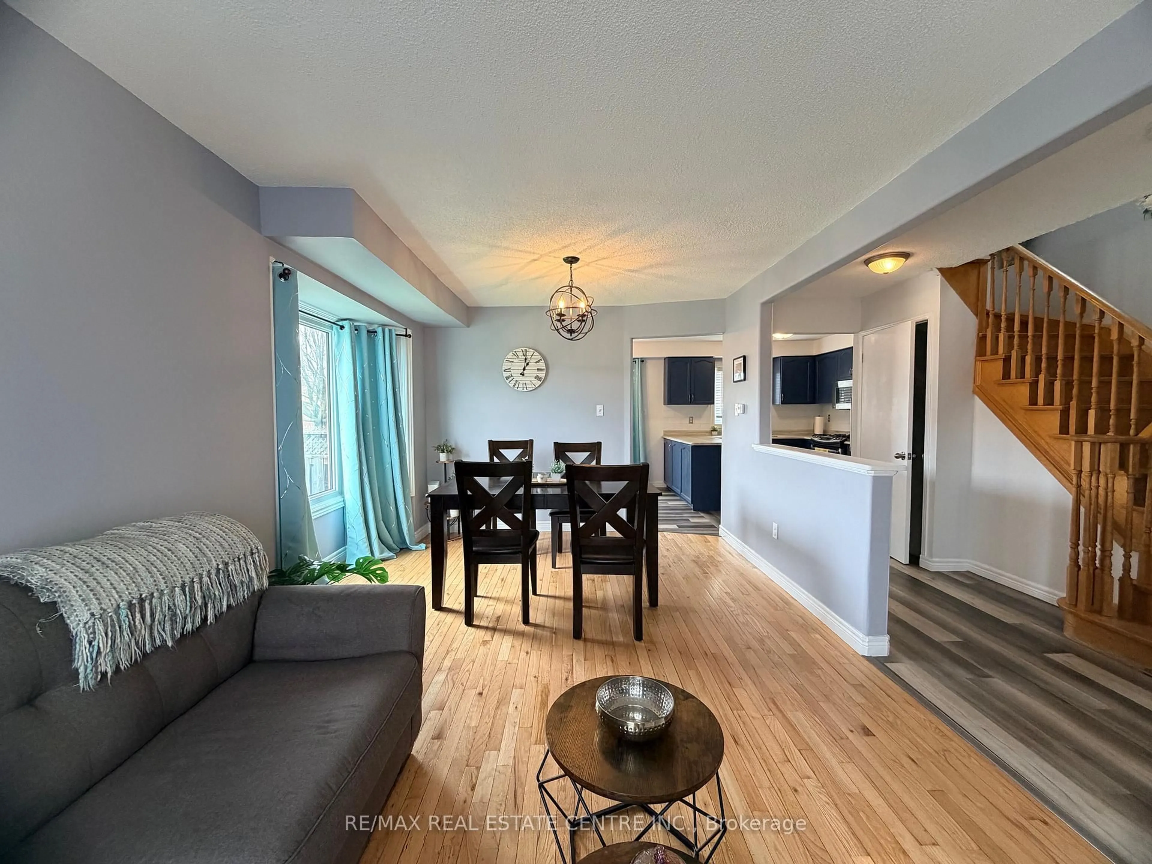 Living room with furniture, wood/laminate floor for 264 Langlaw Dr, Cambridge Ontario N1P 1B7