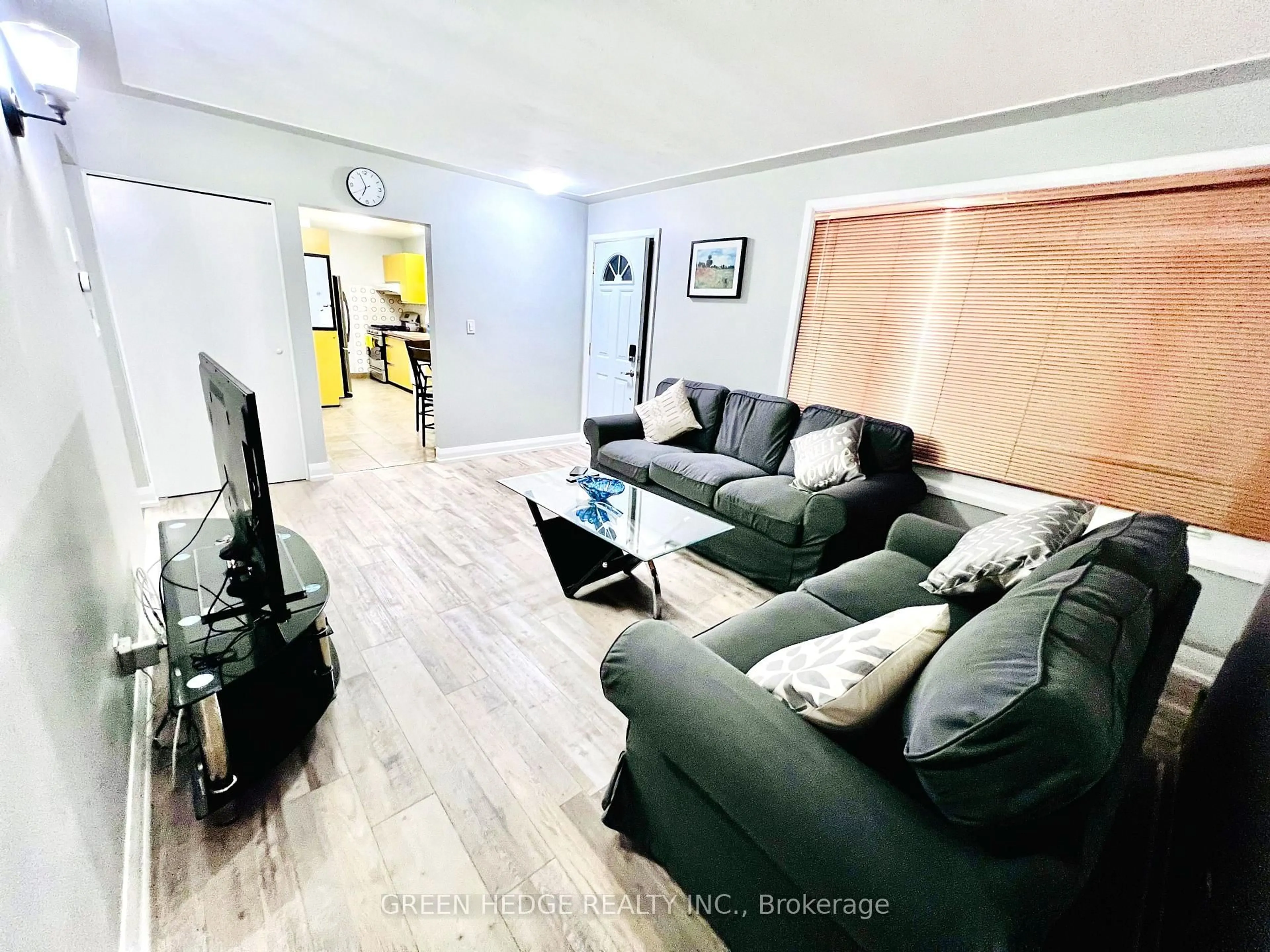 Living room with furniture, wood/laminate floor for 34 Stanley Ave, Kitchener Ontario N2K 1C5