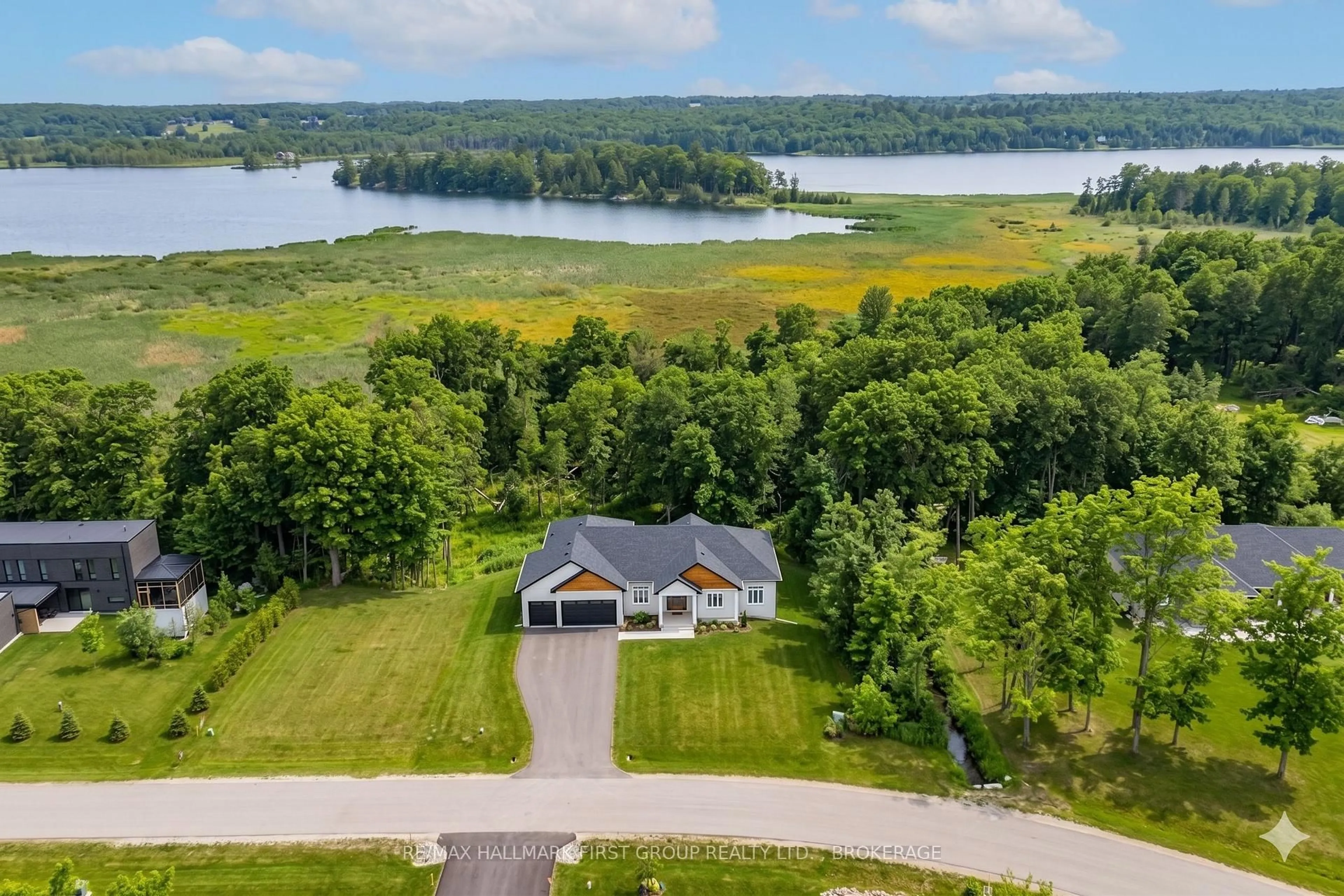 A pic from outside/outdoor area/front of a property/back of a property/a pic from drone, water/lake/river/ocean view for 1111 Kona Cres, Inverary Ontario K0H 1X0