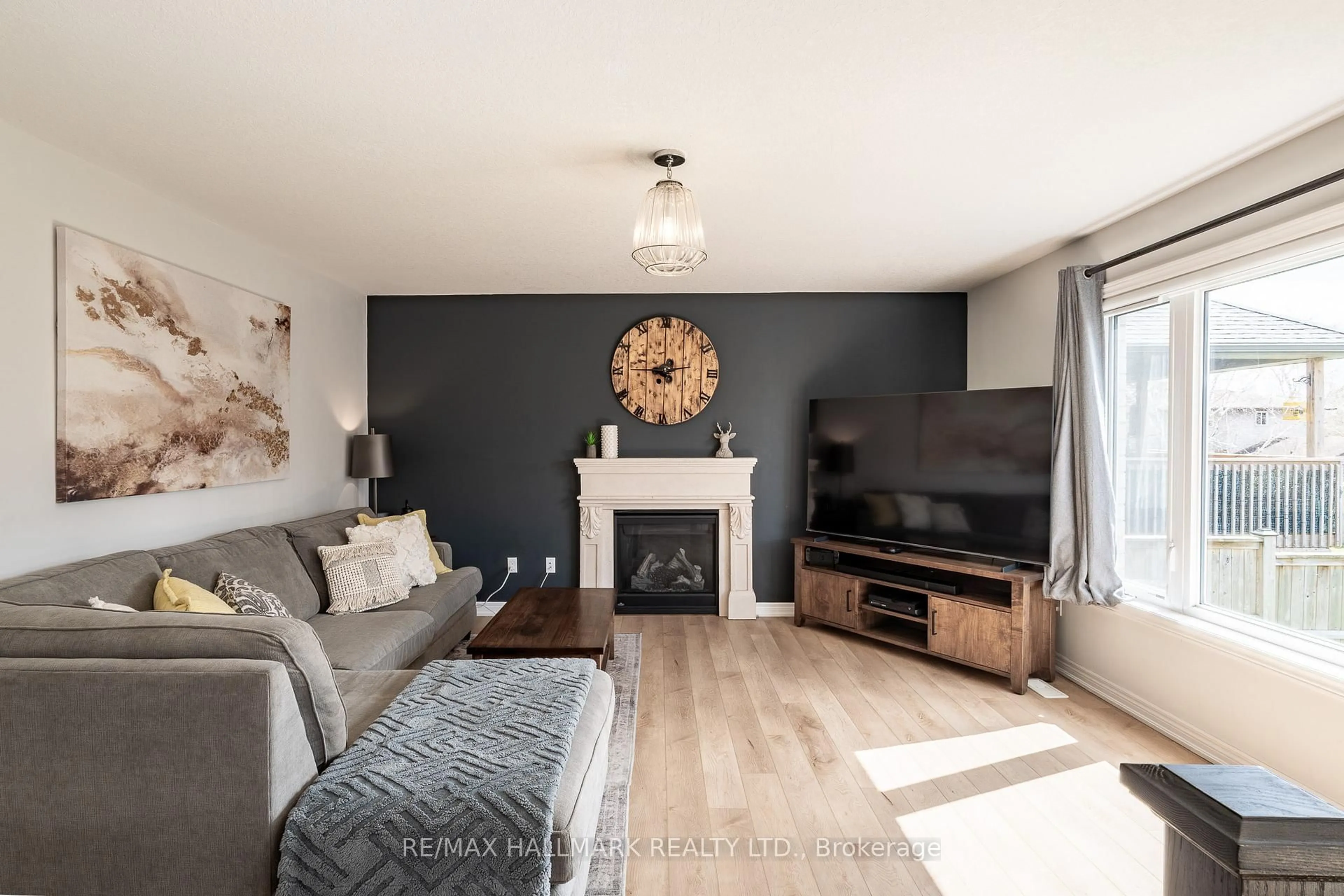 Living room with furniture, wood/laminate floor for 112 Schmidt Dr, Wellington North Ontario N0G 1A0
