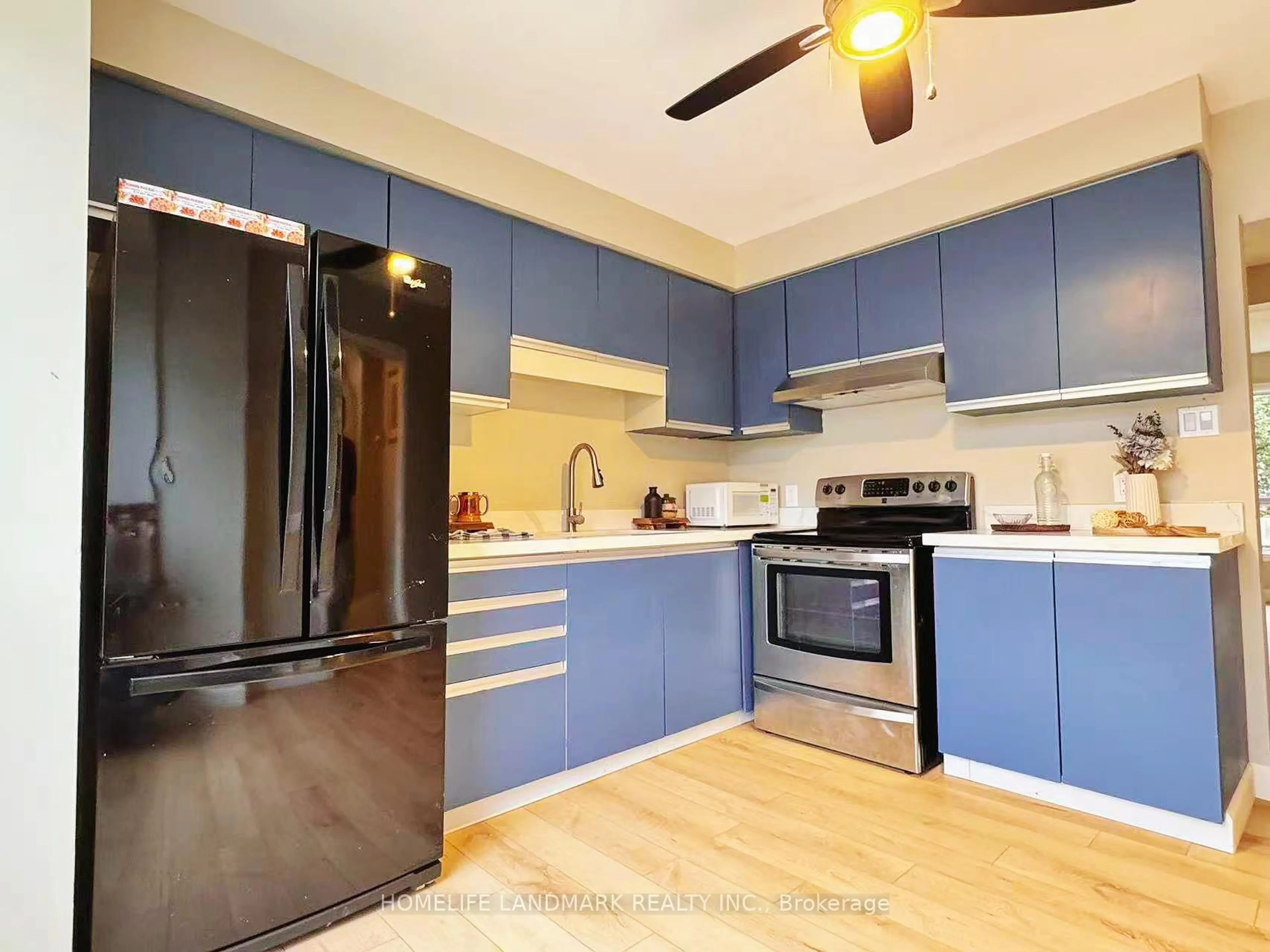 Open concept kitchen, wood/laminate floor for 550 Second St #45, London East Ontario N5V 3S3