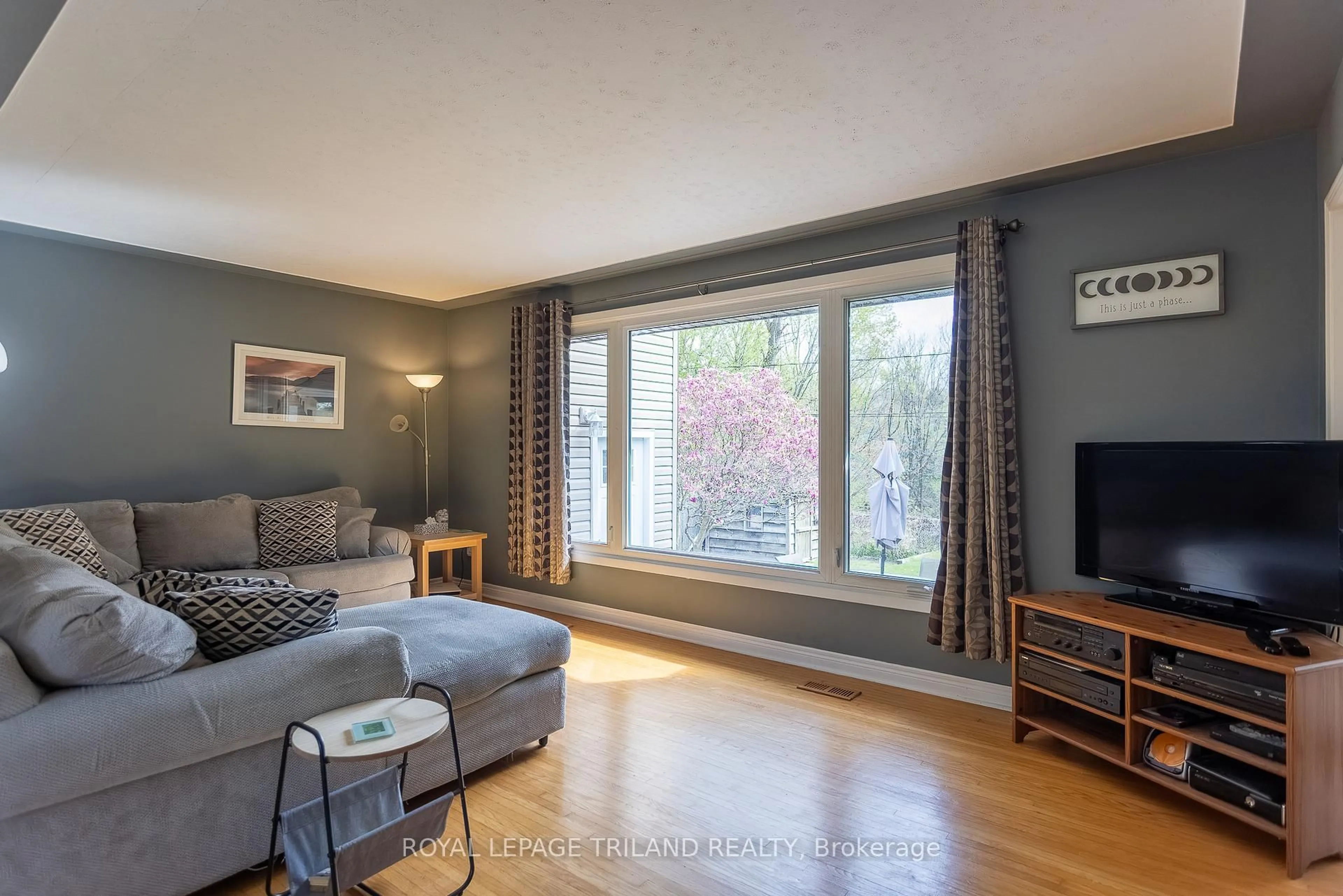 Living room with furniture, wood/laminate floor for 74 Eldorado Ave, London East Ontario N5W 1S5