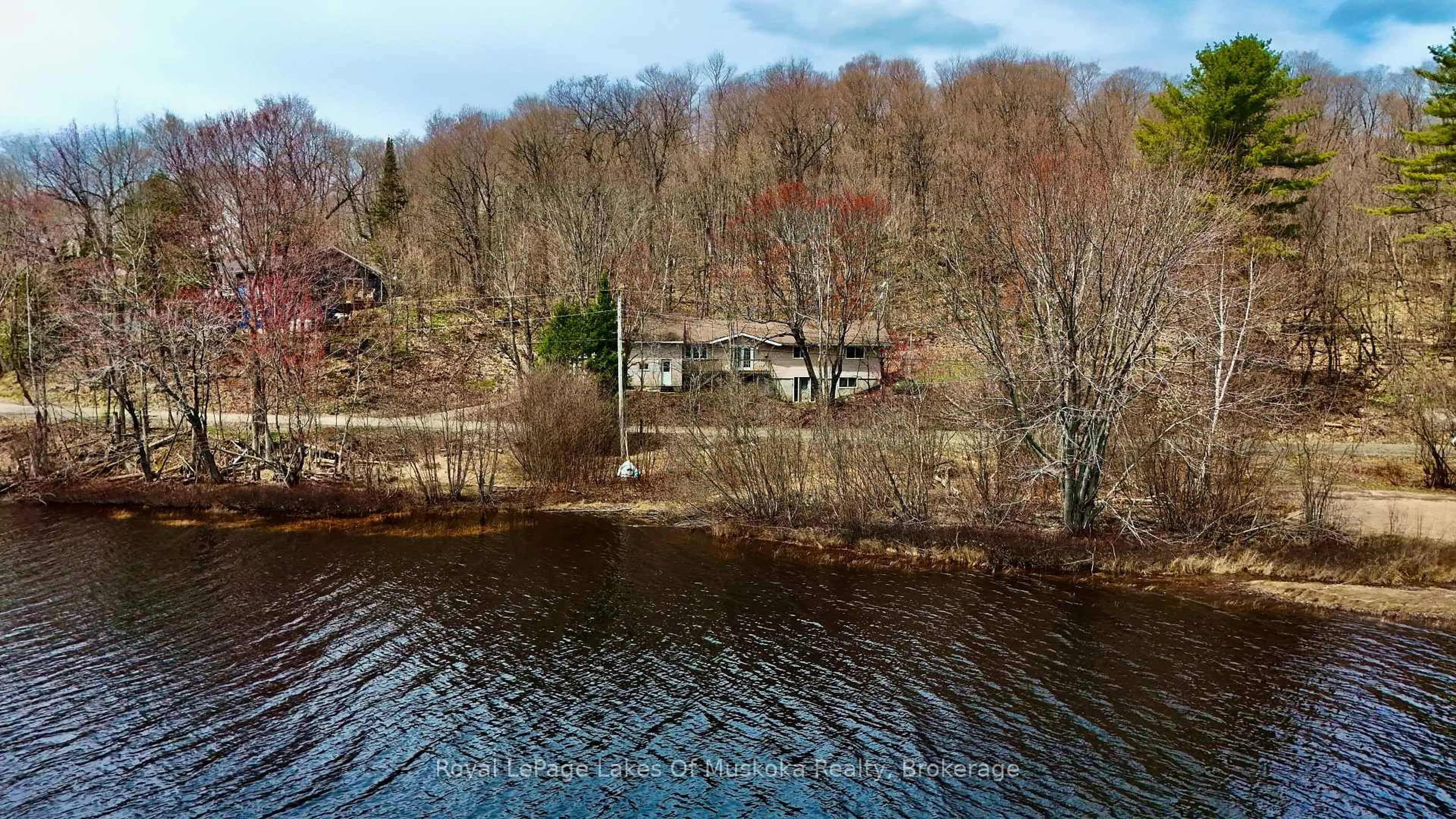 A pic from outside/outdoor area/front of a property/back of a property/a pic from drone, water/lake/river/ocean view for 88 North Deer Lake Rd, Huntsville Ontario P0B 1L0