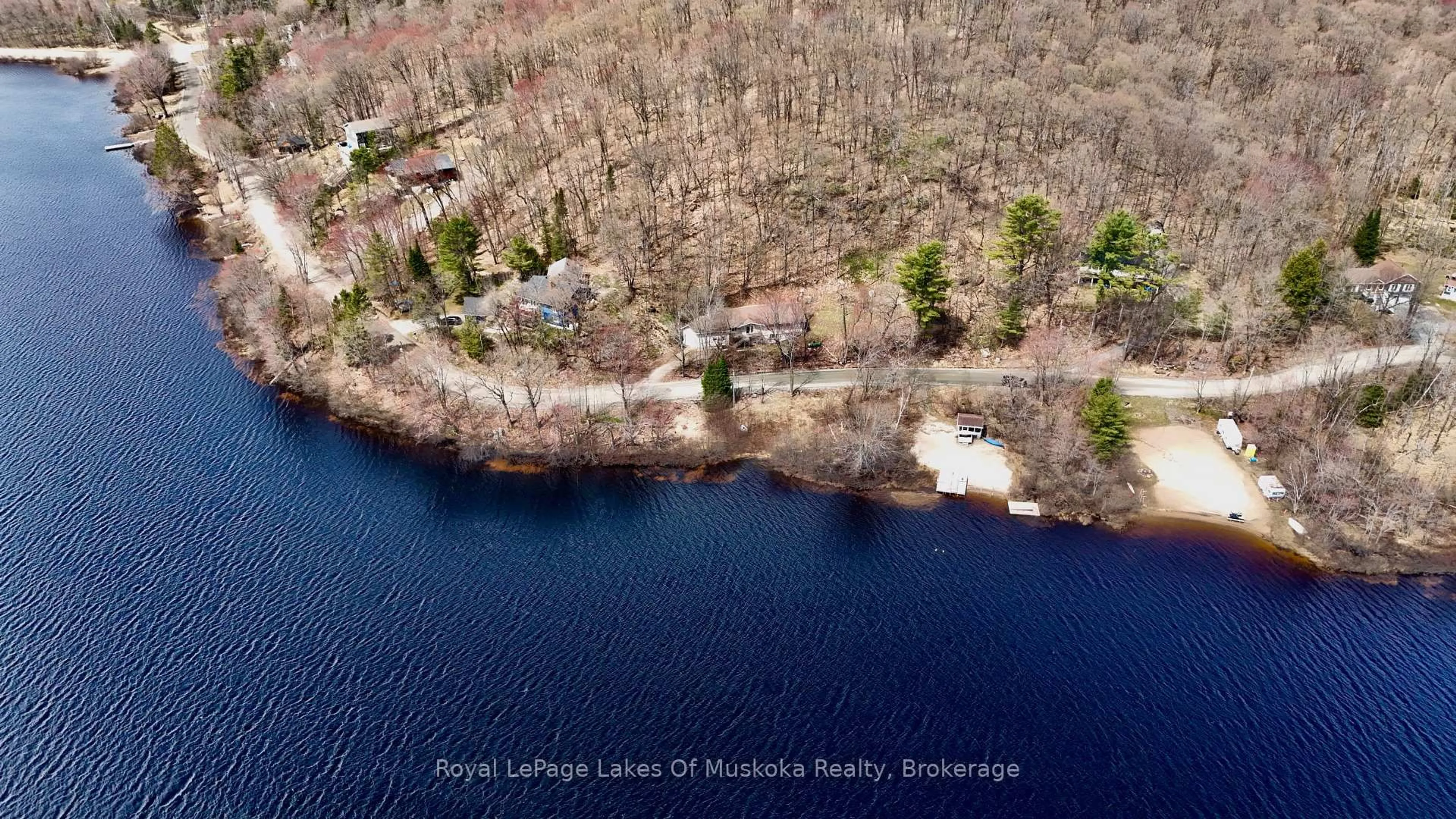 A pic from outside/outdoor area/front of a property/back of a property/a pic from drone, water/lake/river/ocean view for 88 North Deer Lake Rd, Huntsville Ontario P0B 1L0