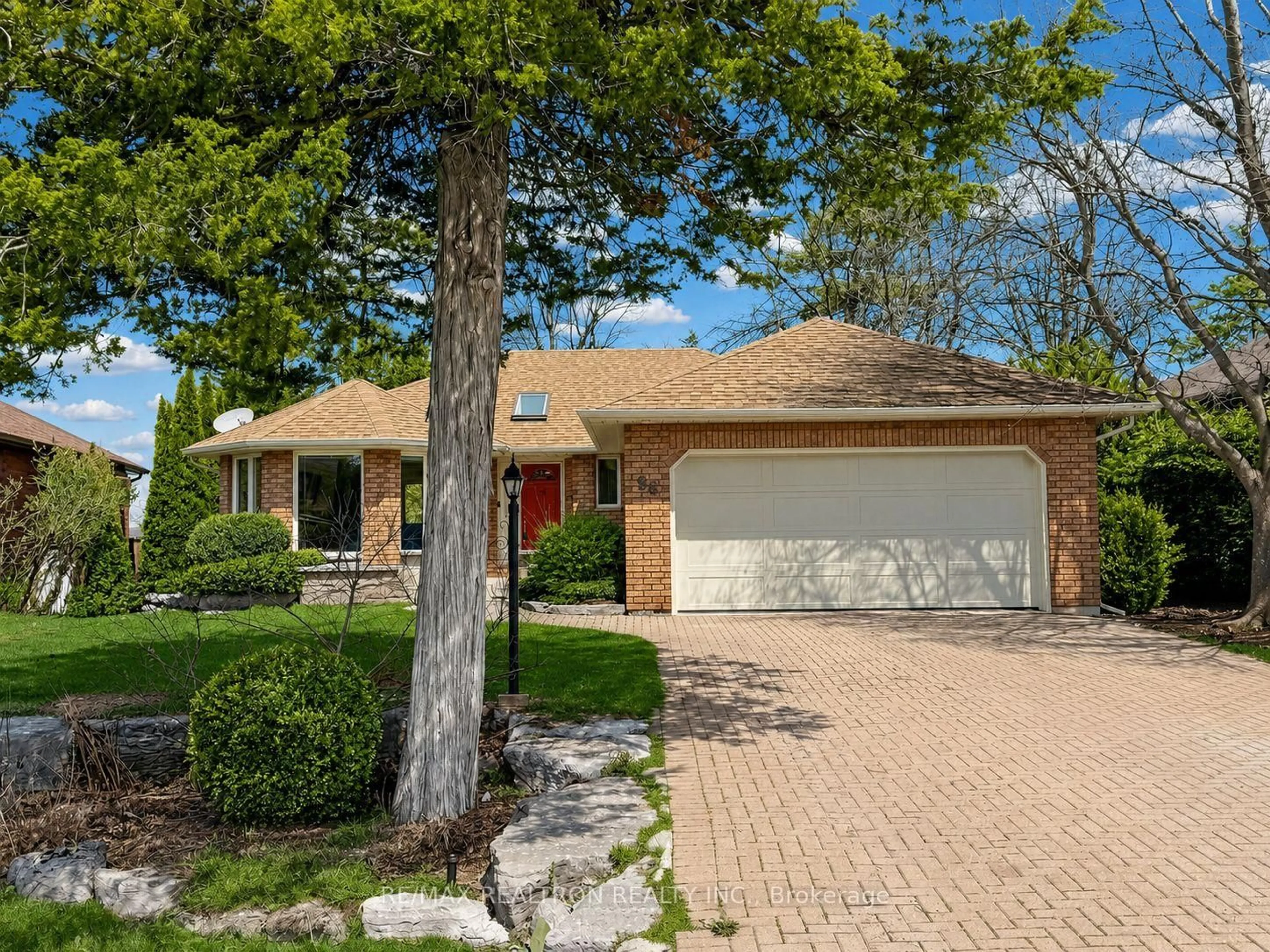 Home with brick exterior material, street for 98 Navigators Trail, Kawartha Lakes Ontario K0M 1A0