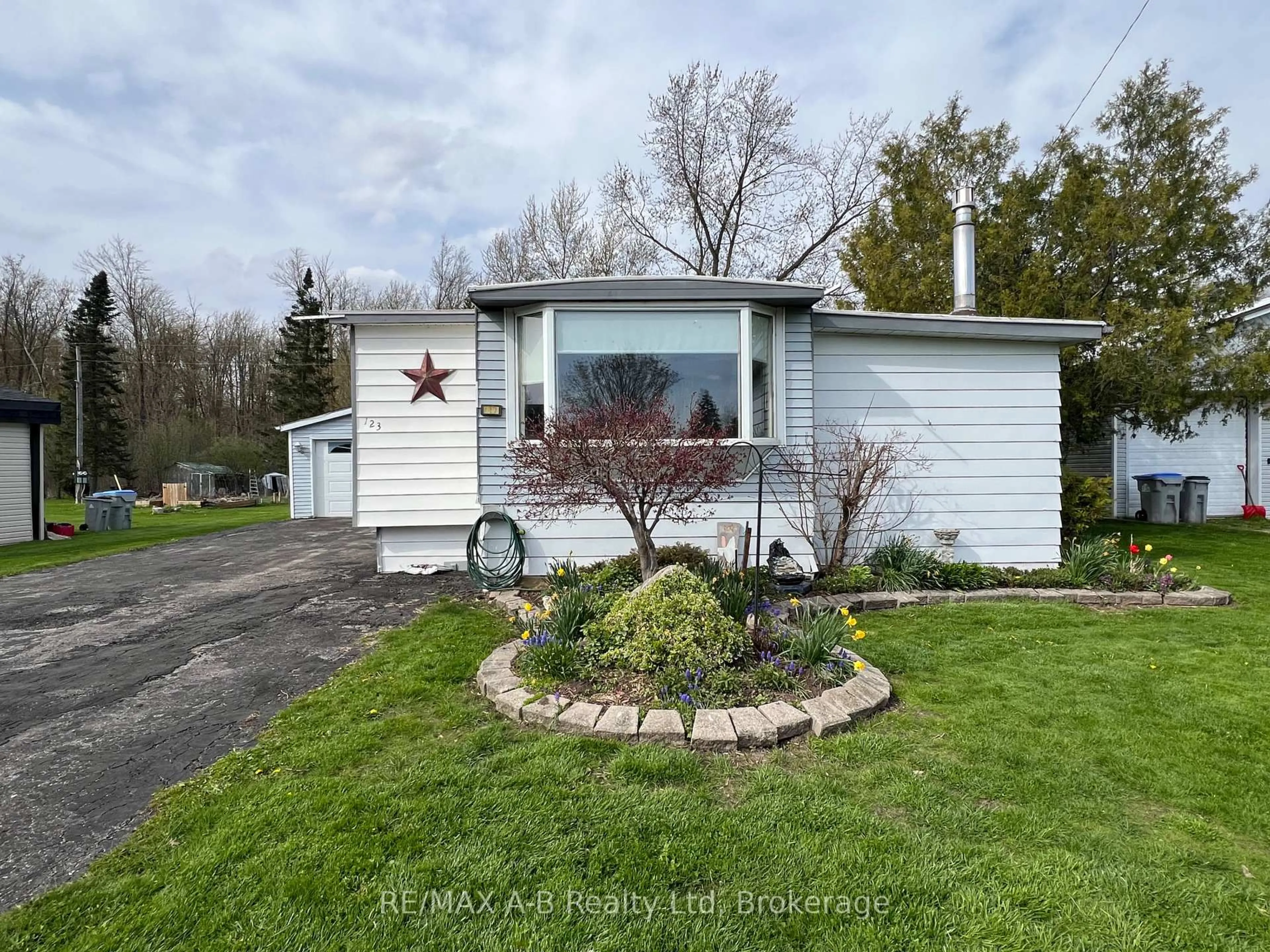 Home with vinyl exterior material, street for 123 Ash St, Perth East Ontario N5A 6S6