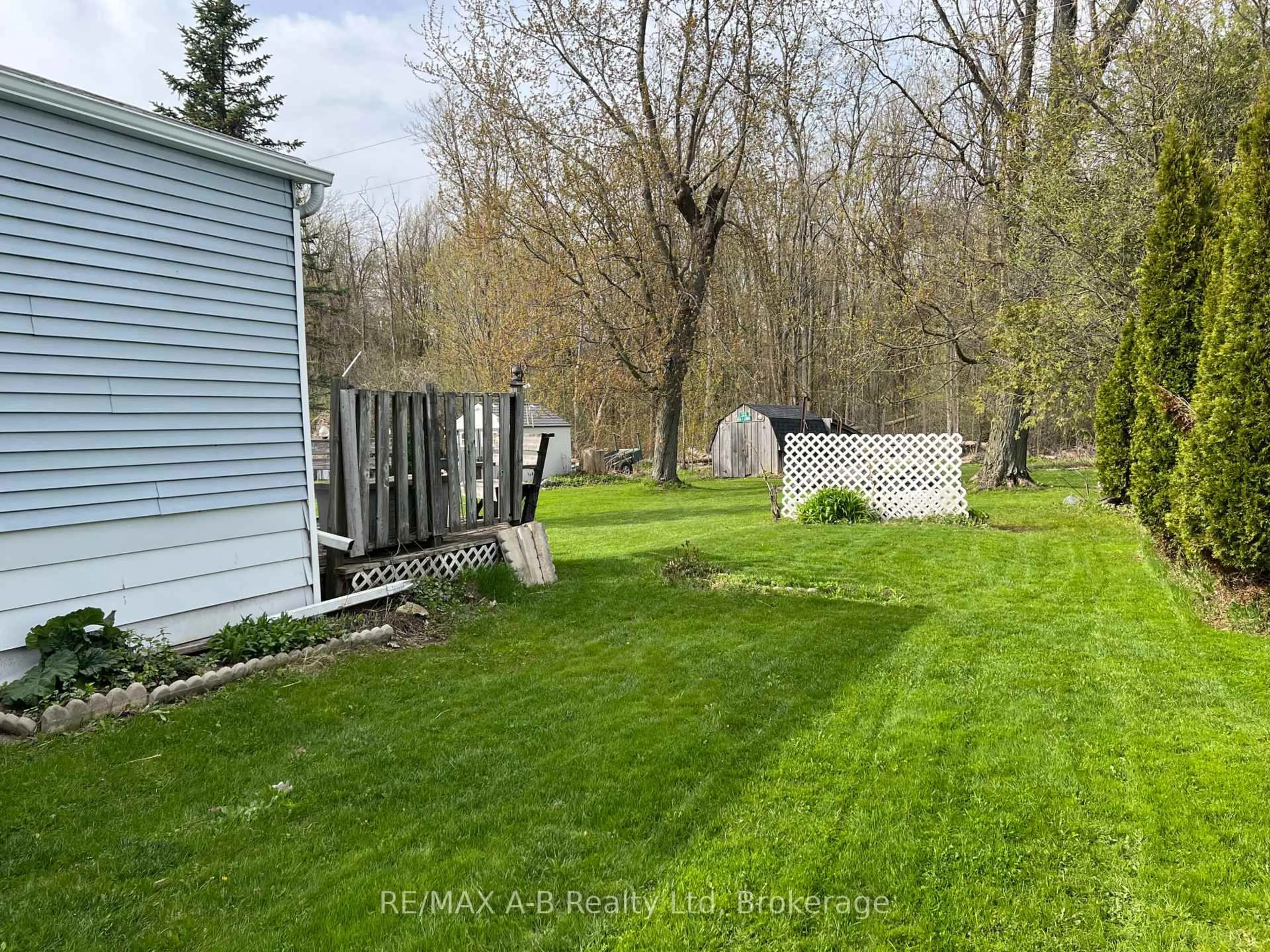 A pic from outside/outdoor area/front of a property/back of a property/a pic from drone, forest/trees view for 123 Ash St, Perth East Ontario N5A 6S6