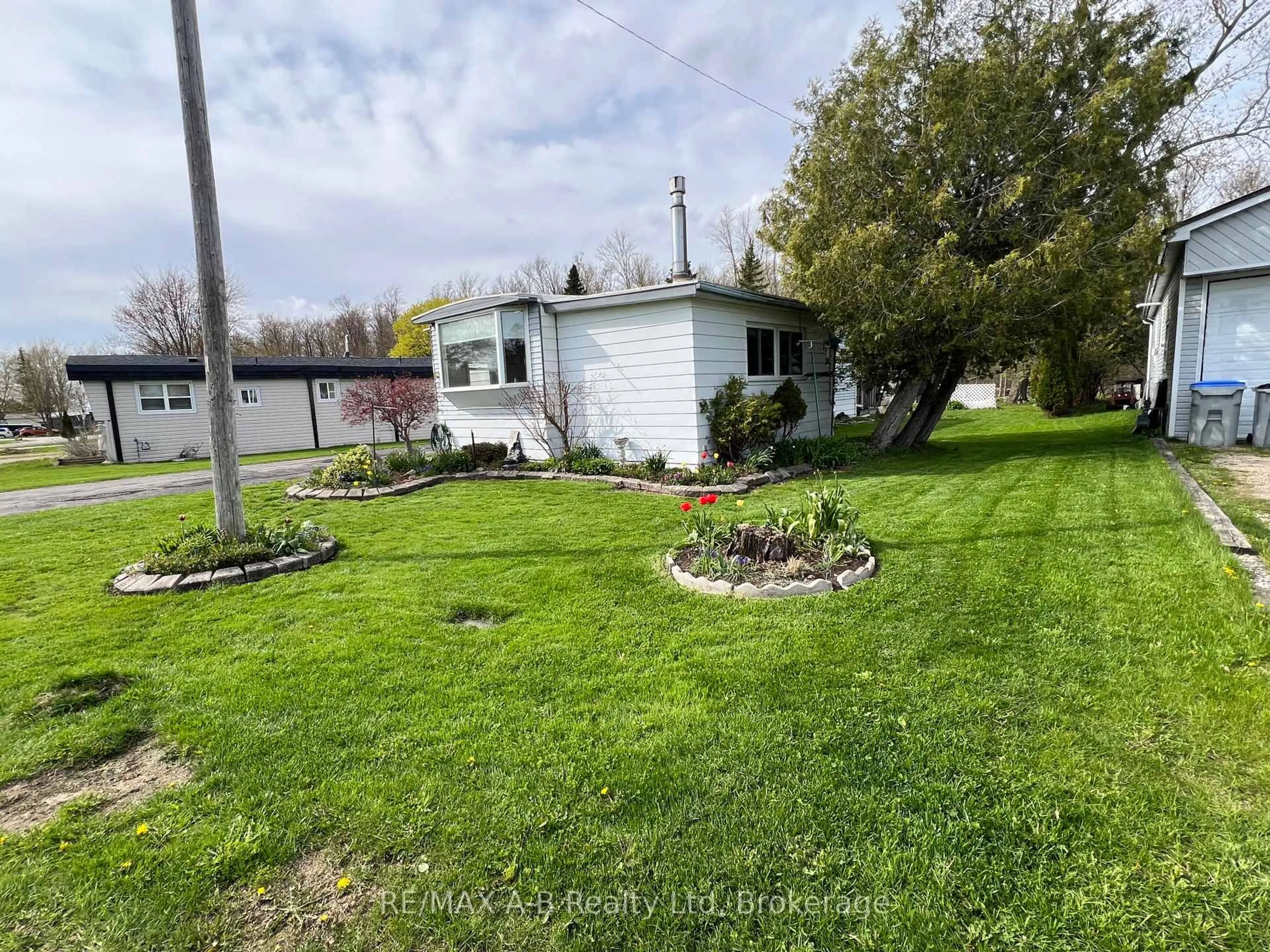 A pic from outside/outdoor area/front of a property/back of a property/a pic from drone, water/lake/river/ocean view for 123 Ash St, Perth East Ontario N5A 6S6