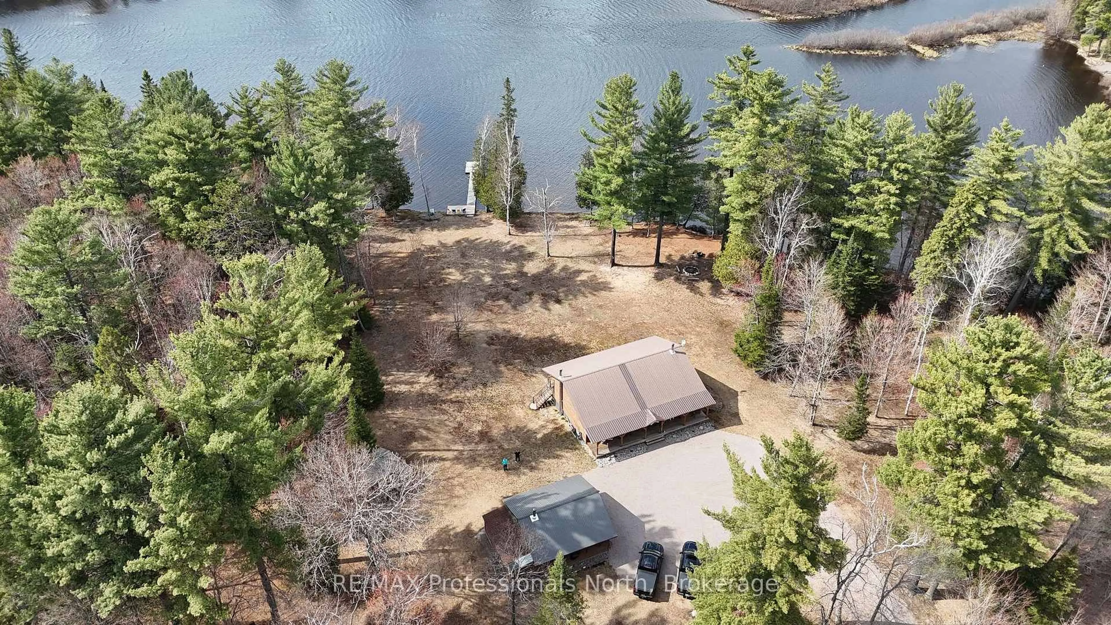 A pic from outside/outdoor area/front of a property/back of a property/a pic from drone, water/lake/river/ocean view for 3951 Elephant Lake Rd, Dysart et al Ontario K0L 1X0