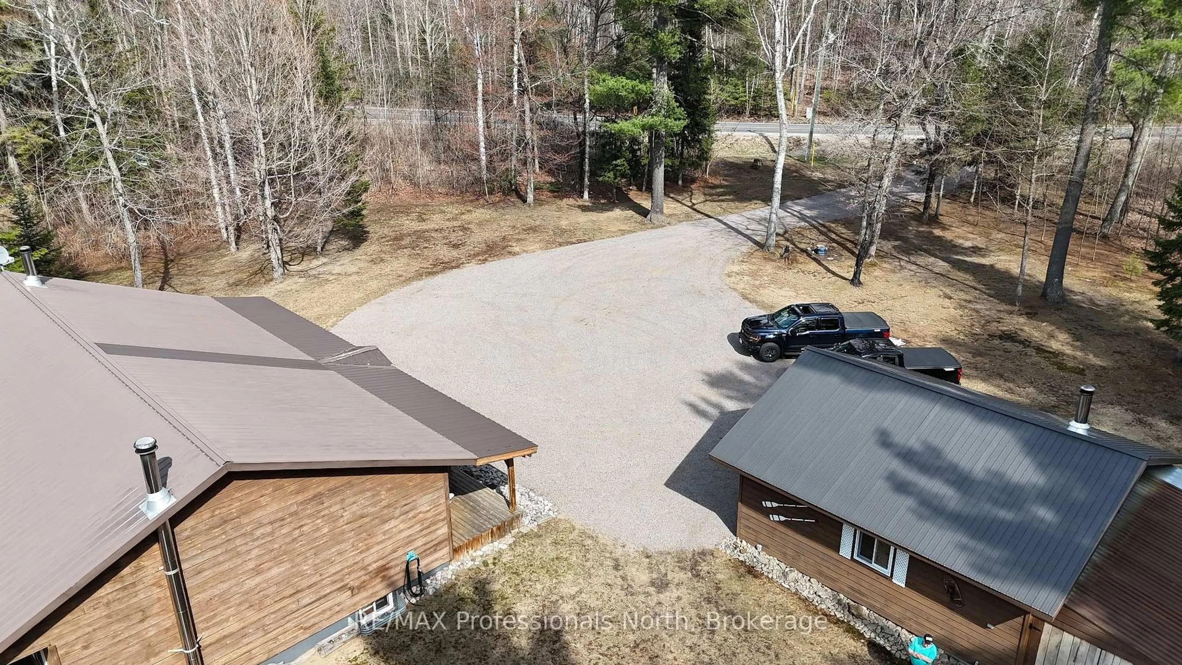 A pic from outside/outdoor area/front of a property/back of a property/a pic from drone, water/lake/river/ocean view for 3951 Elephant Lake Rd, Dysart et al Ontario K0L 1X0