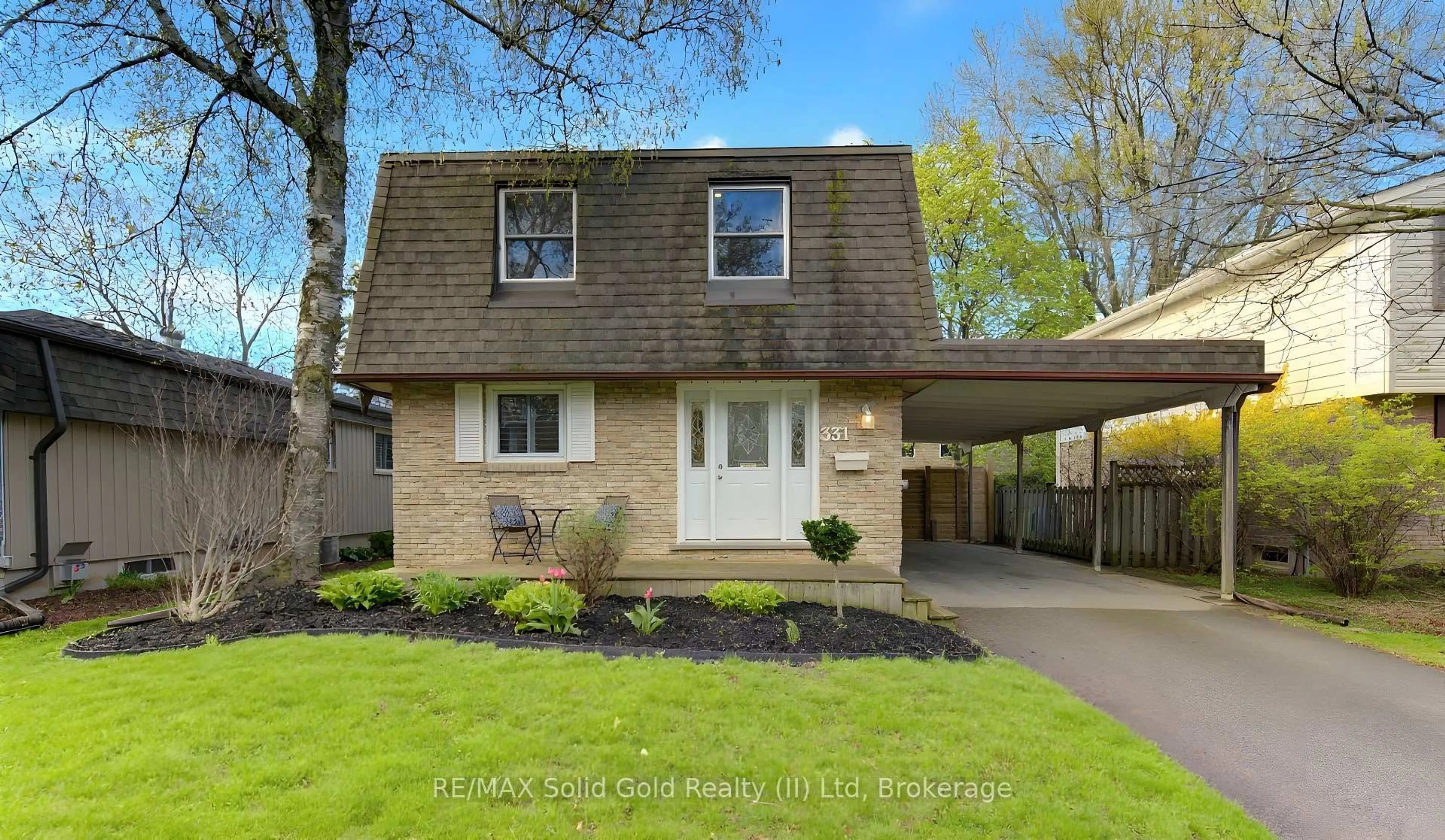 Home with brick exterior material, street for 331 Dansbury Dr, Waterloo Ontario N2K 2M1