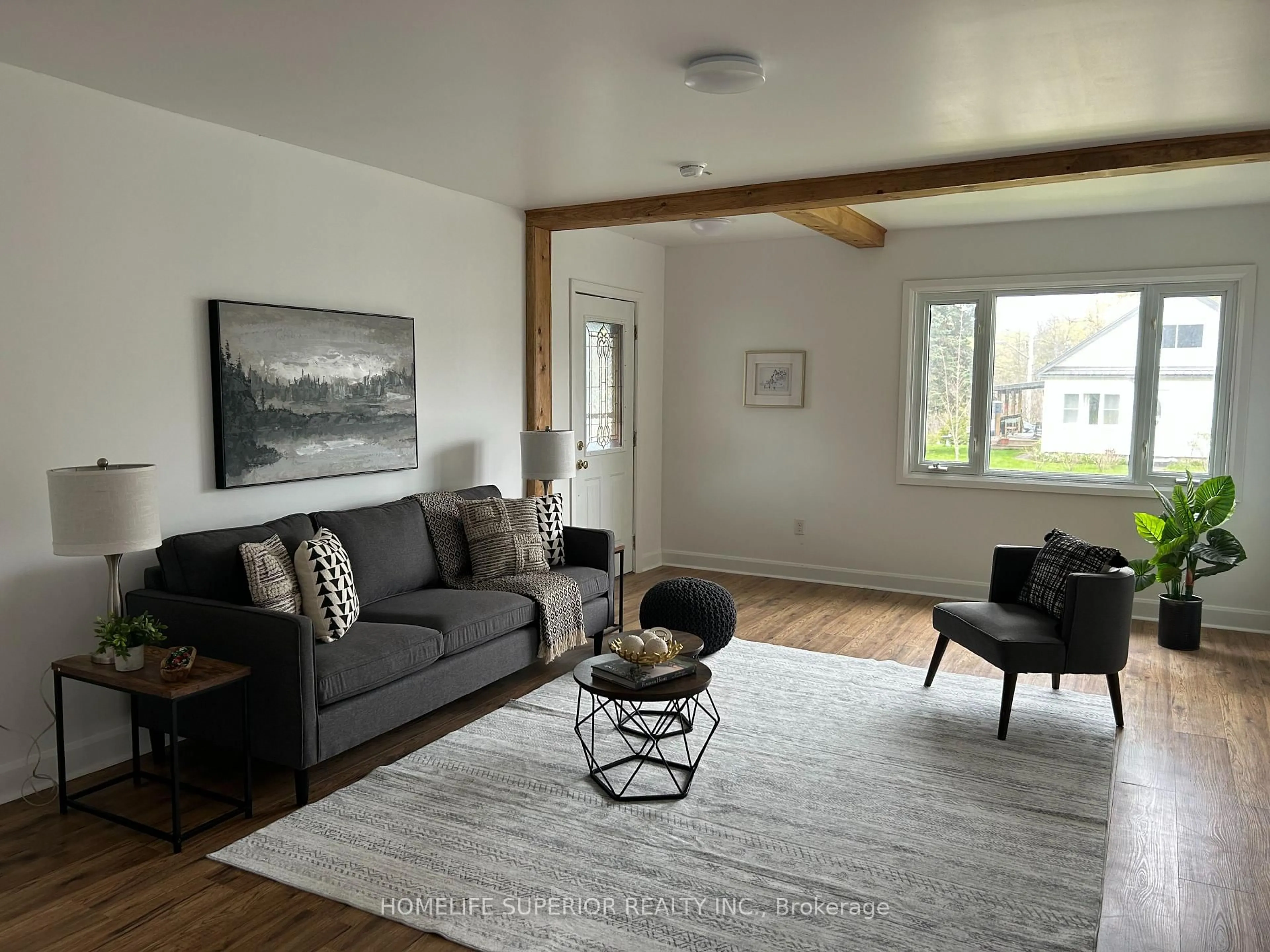Living room with furniture, wood/laminate floor for 1029 St. Marks Rd, Limoges Ontario K0K 2M0