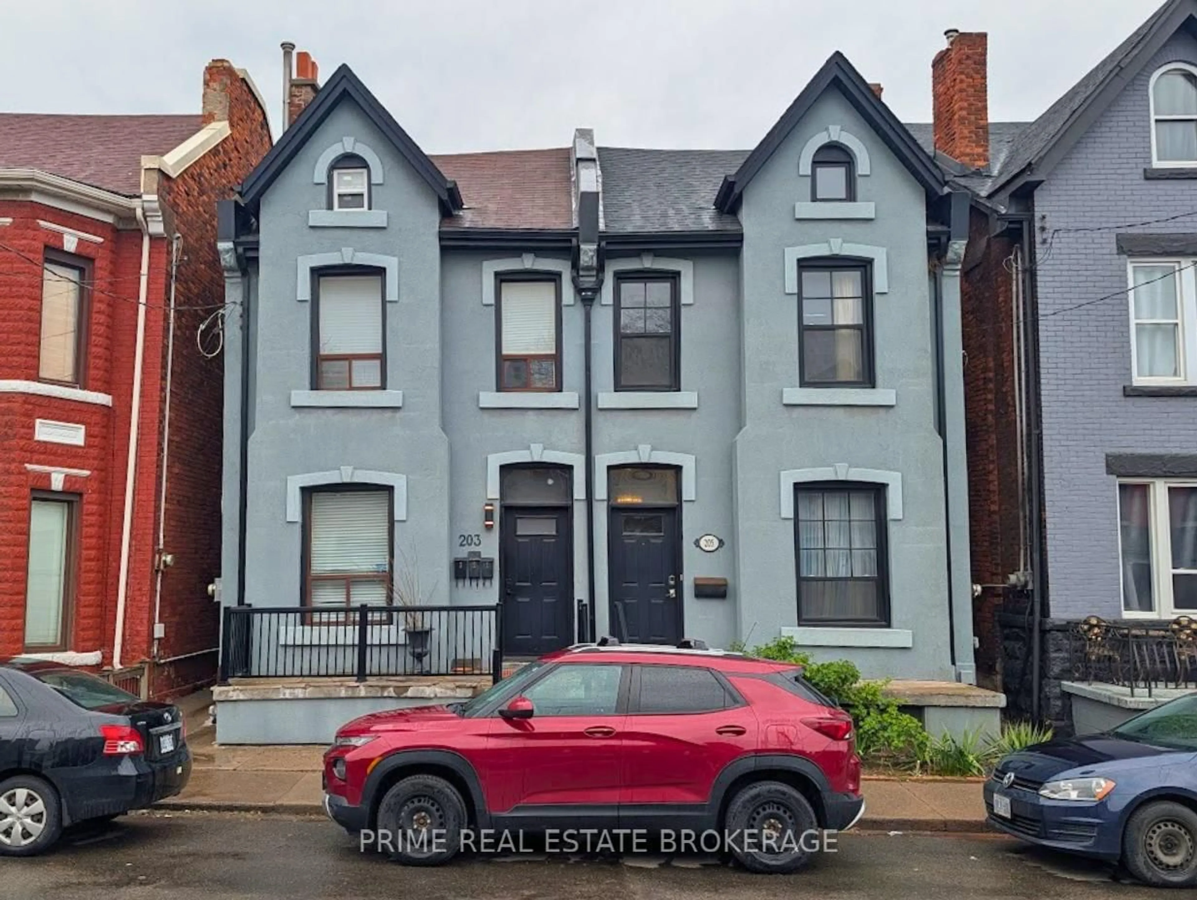Home with brick exterior material, street for 203 John St, Hamilton Ontario L8L 4P4