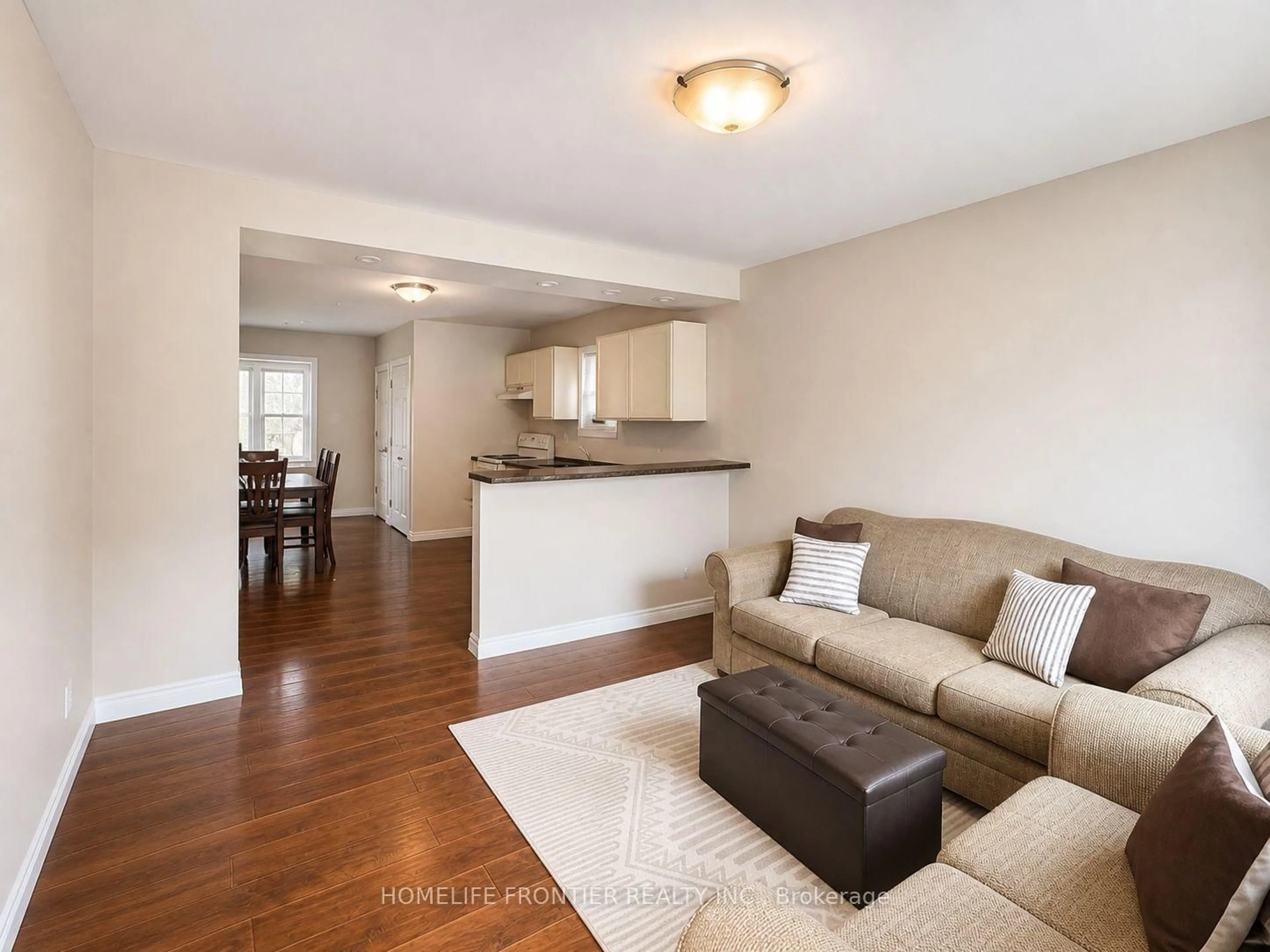Living room with furniture, wood/laminate floor for 110 St Julien St, London East Ontario N5Z 2M7