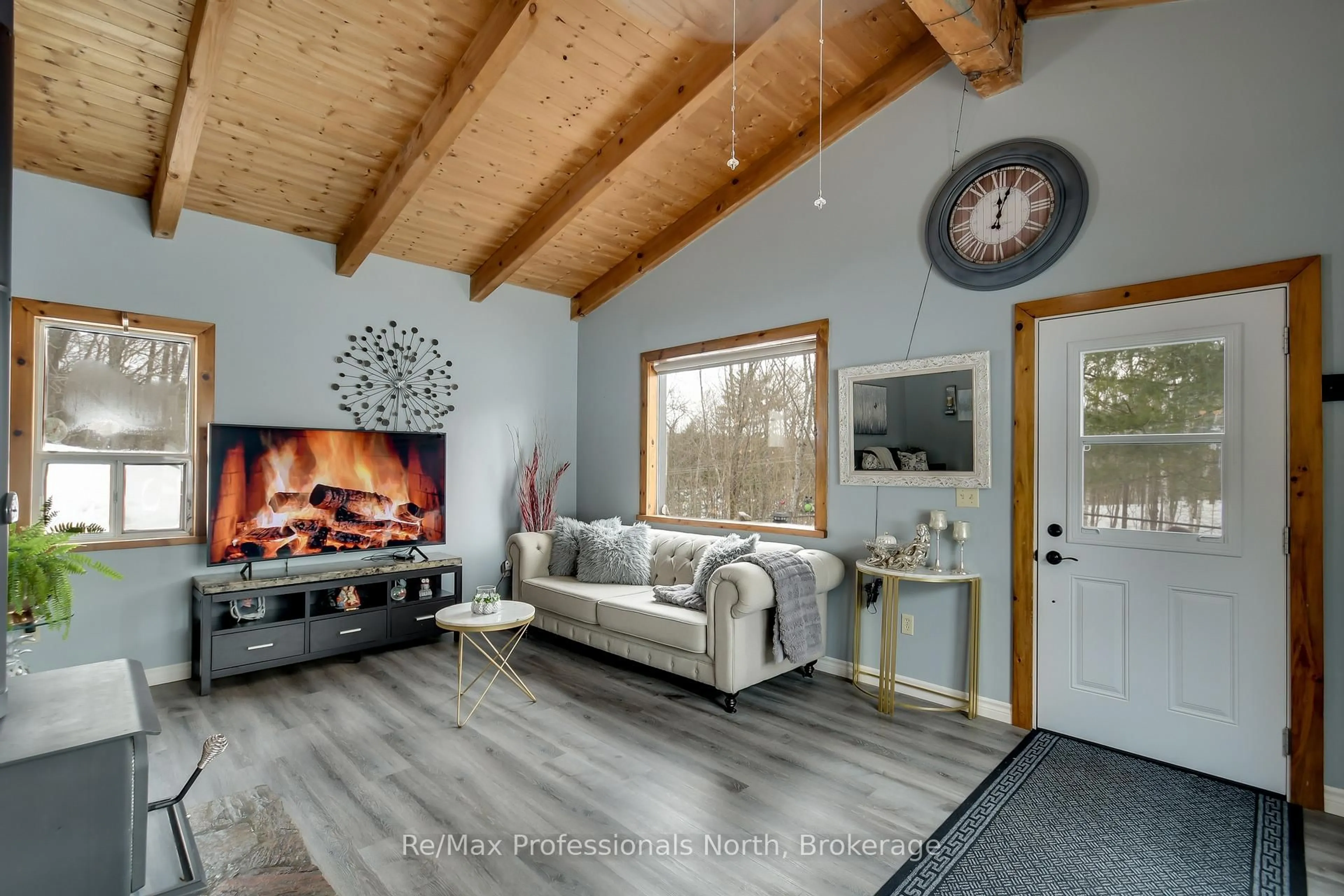 Living room with furniture, wood/laminate floor for 1017 BARLOCHAN Rd, Muskoka Lakes Ontario P1P 1R2