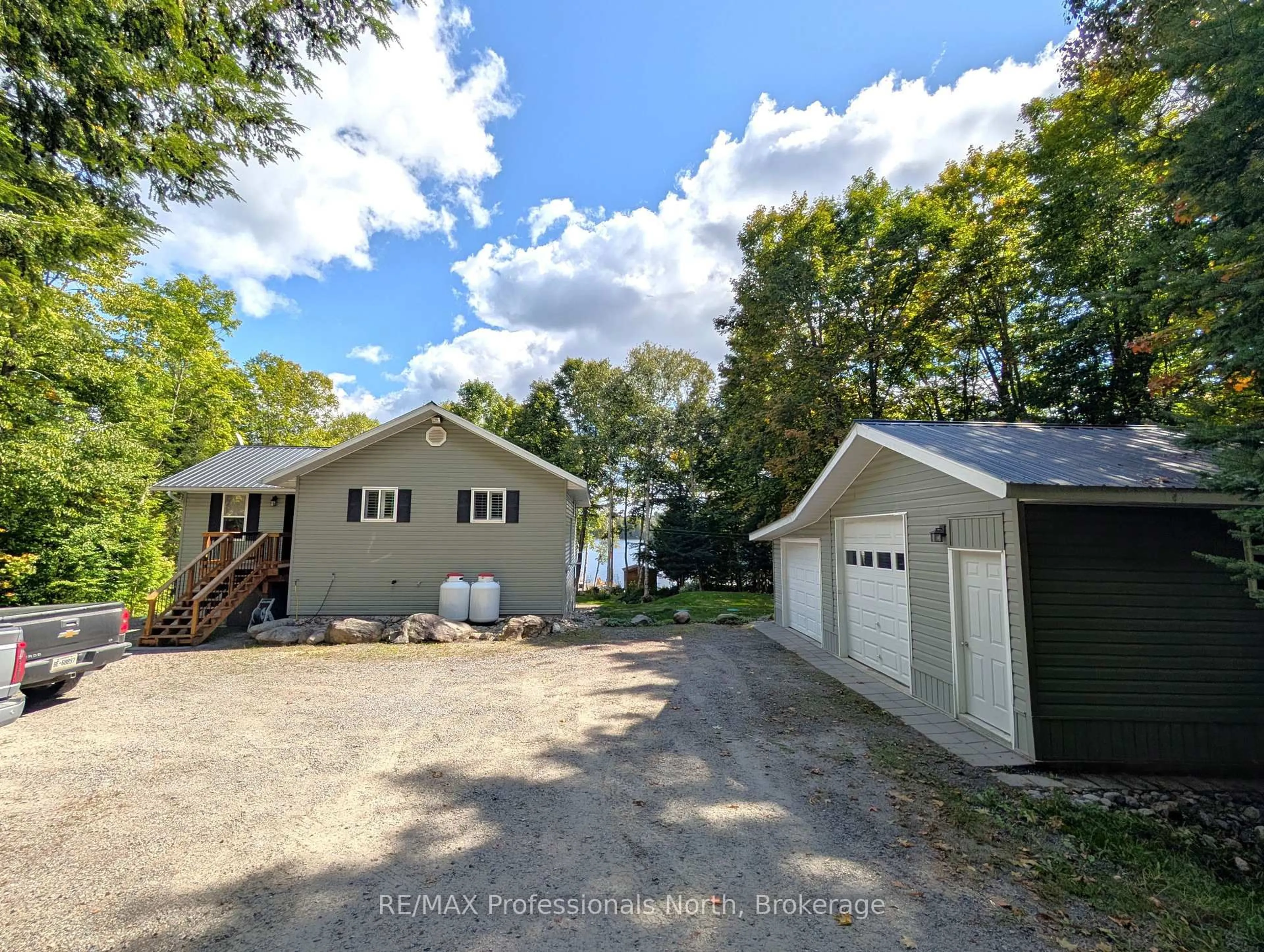 A pic from outside/outdoor area/front of a property/back of a property/a pic from drone, water/lake/river/ocean view for 1173 SPRING LAKE Rd, Parry Sound Remote Area Ontario P0A 1X0
