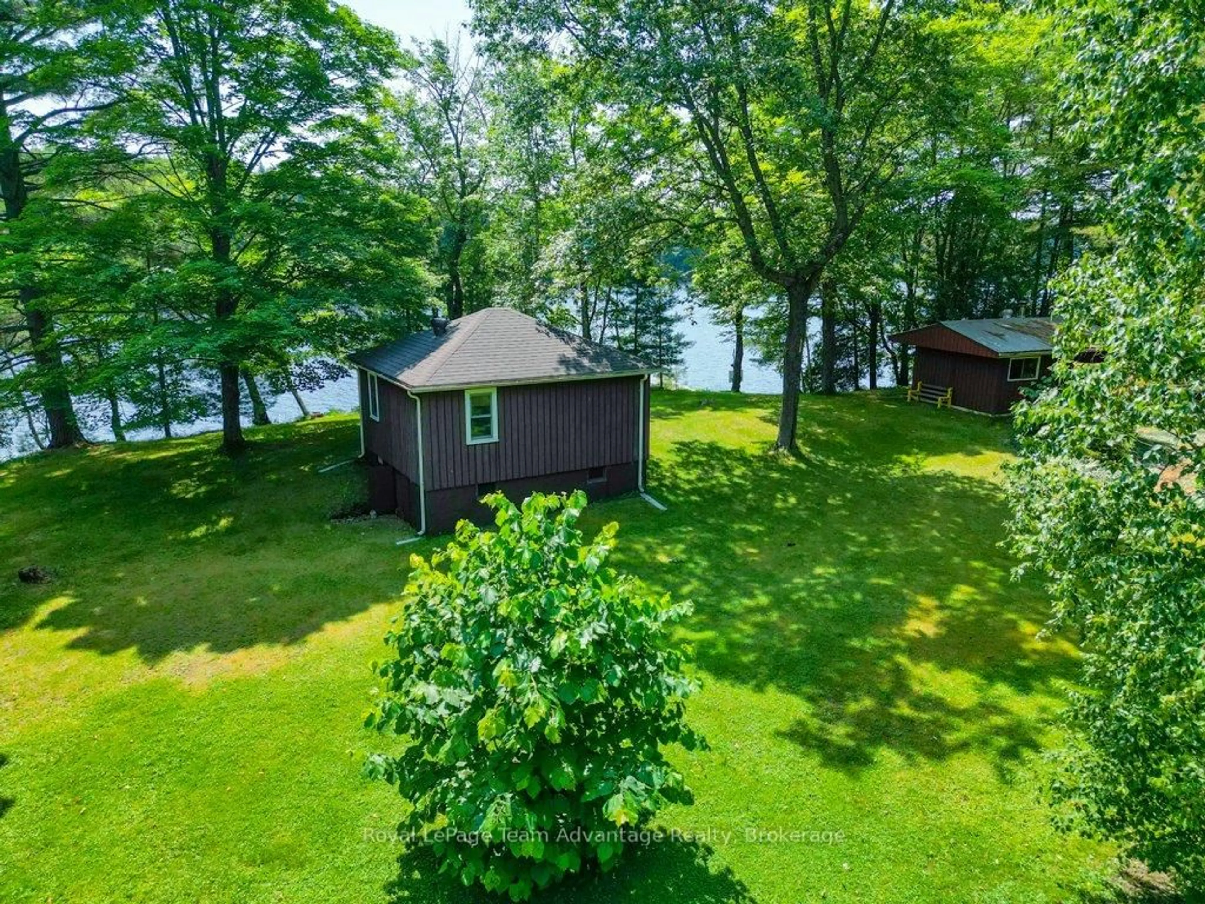 A pic from outside/outdoor area/front of a property/back of a property/a pic from drone, water/lake/river/ocean view for 11 Birch Lane, McDougall Ontario P2A 2W7