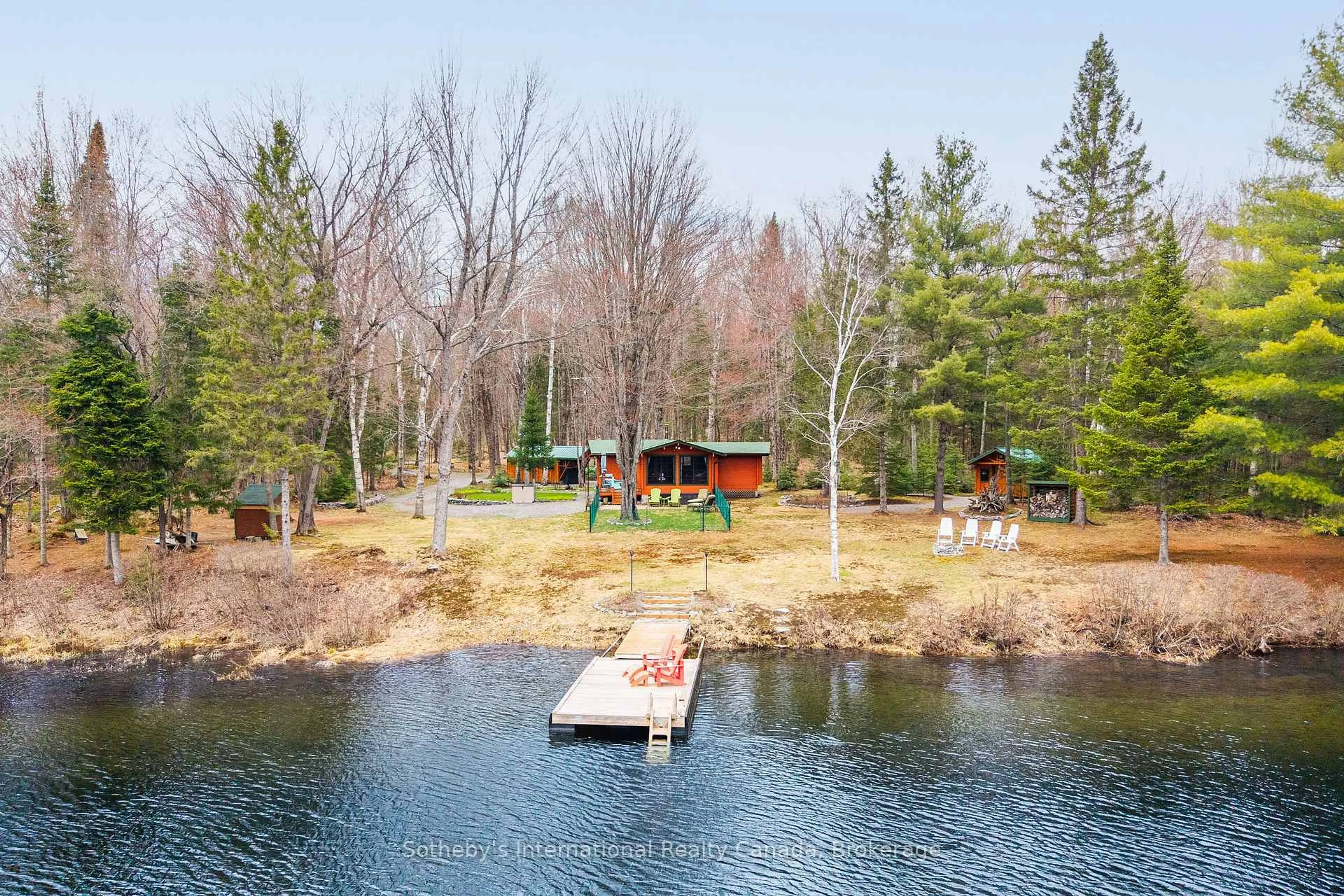 A pic from outside/outdoor area/front of a property/back of a property/a pic from drone, water/lake/river/ocean view for 1041 Crockford Lane, Bracebridge Ontario P1L 1X3