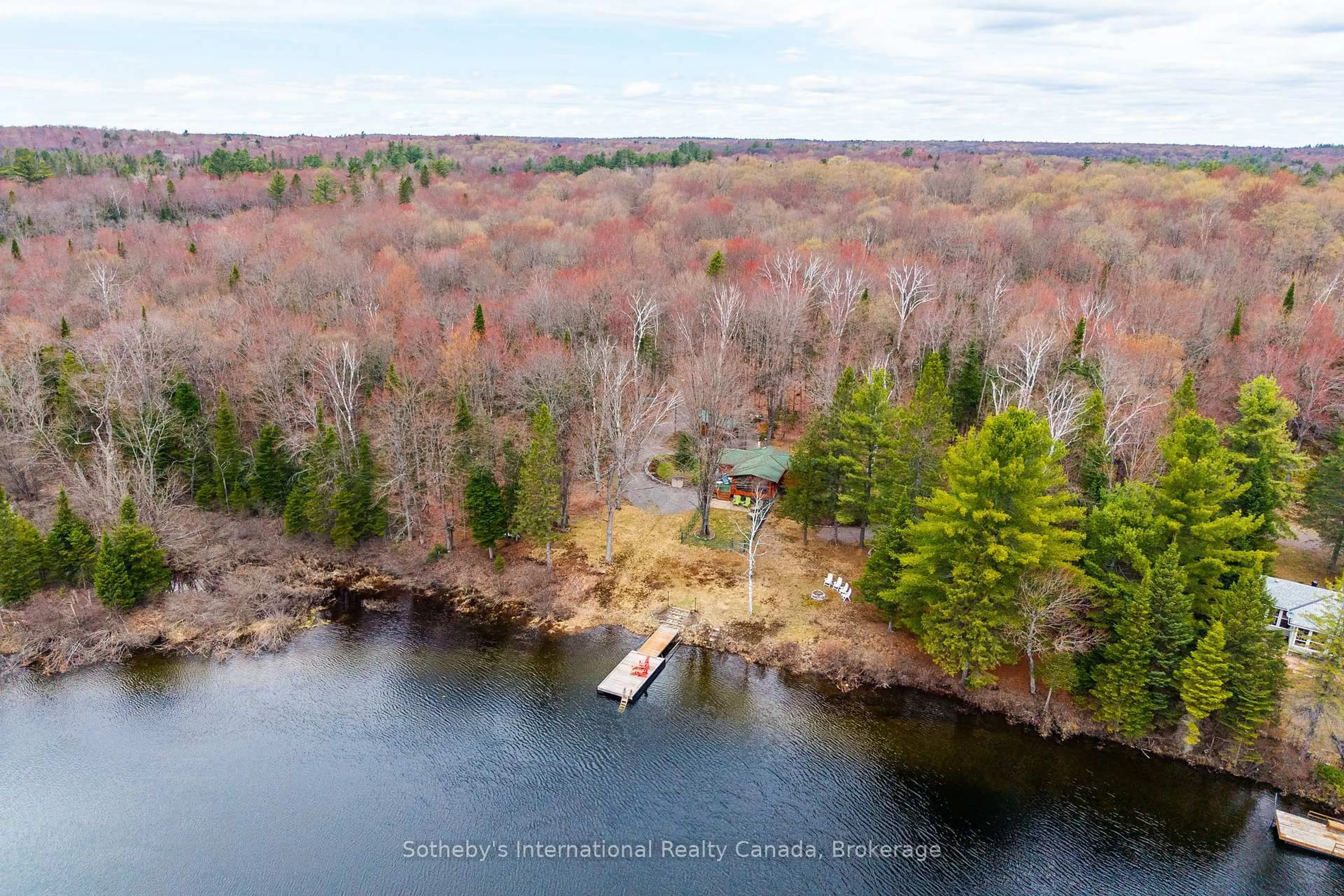 A pic from outside/outdoor area/front of a property/back of a property/a pic from drone, water/lake/river/ocean view for 1041 Crockford Lane, Bracebridge Ontario P1L 1X3
