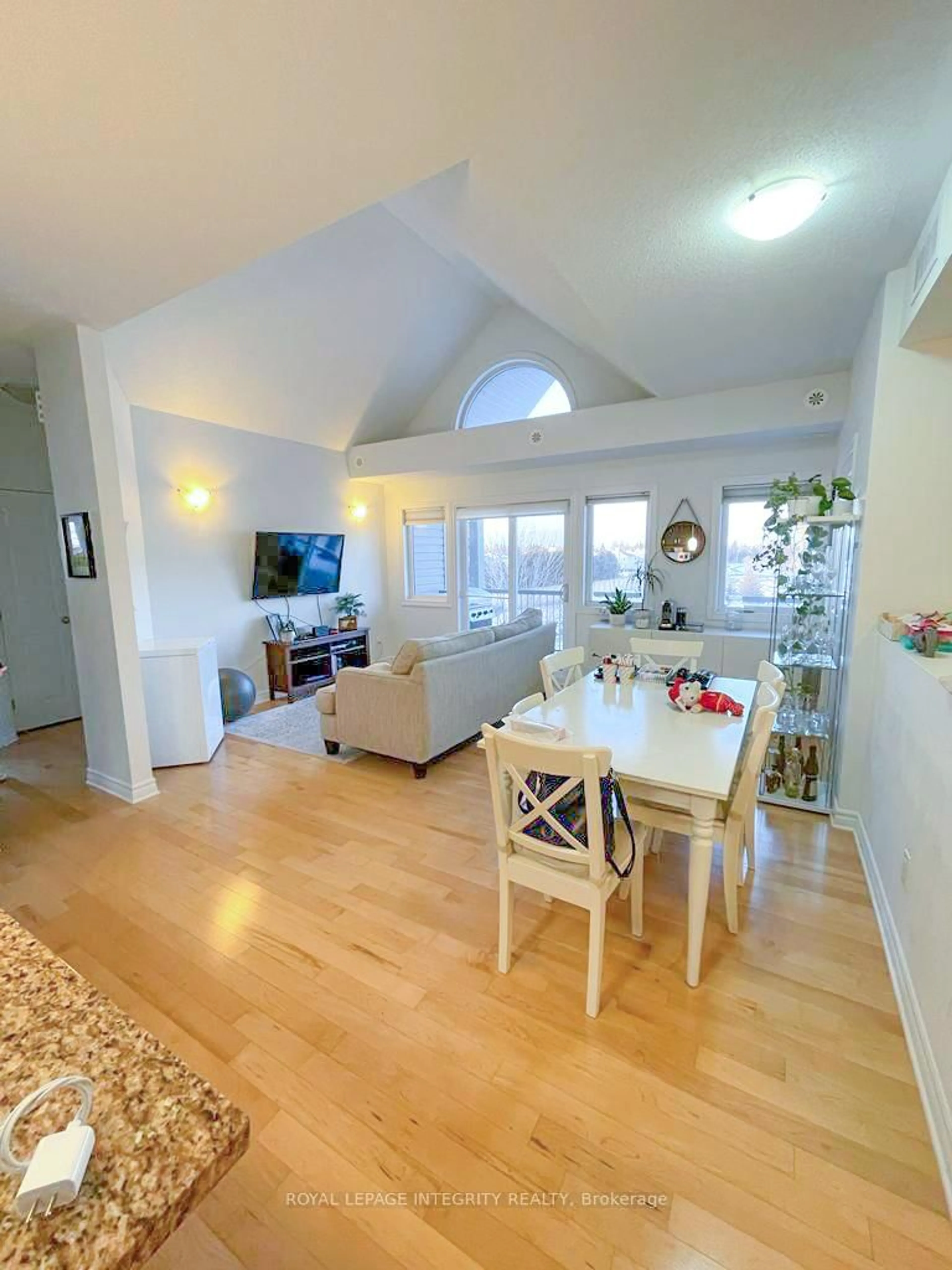 Living room with furniture, wood/laminate floor for 105 Fraser Fields Way #K, Ottawa Ontario K2J 5V1